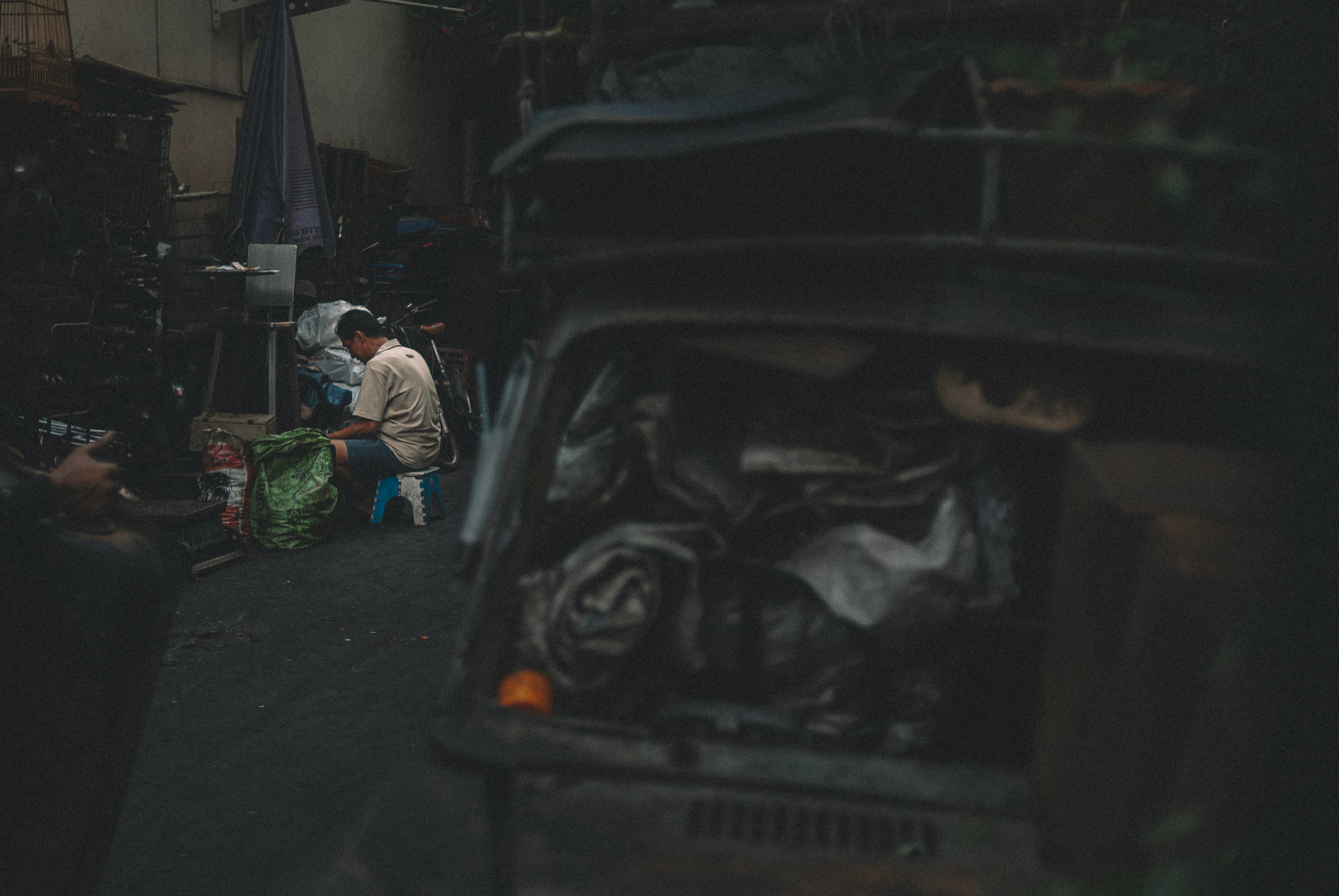 A man seated in his garage | Source: Unsplash
