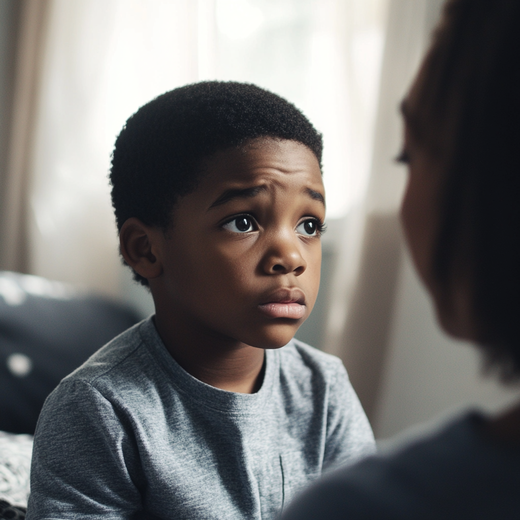 A sad boy talking to his mother | Source: Midjourney