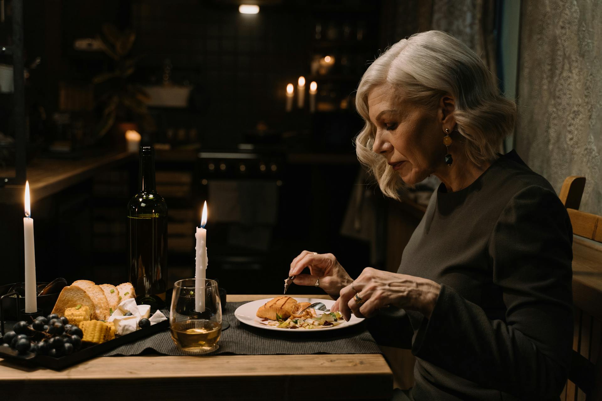 An older woman having dinner | Source: Pexels