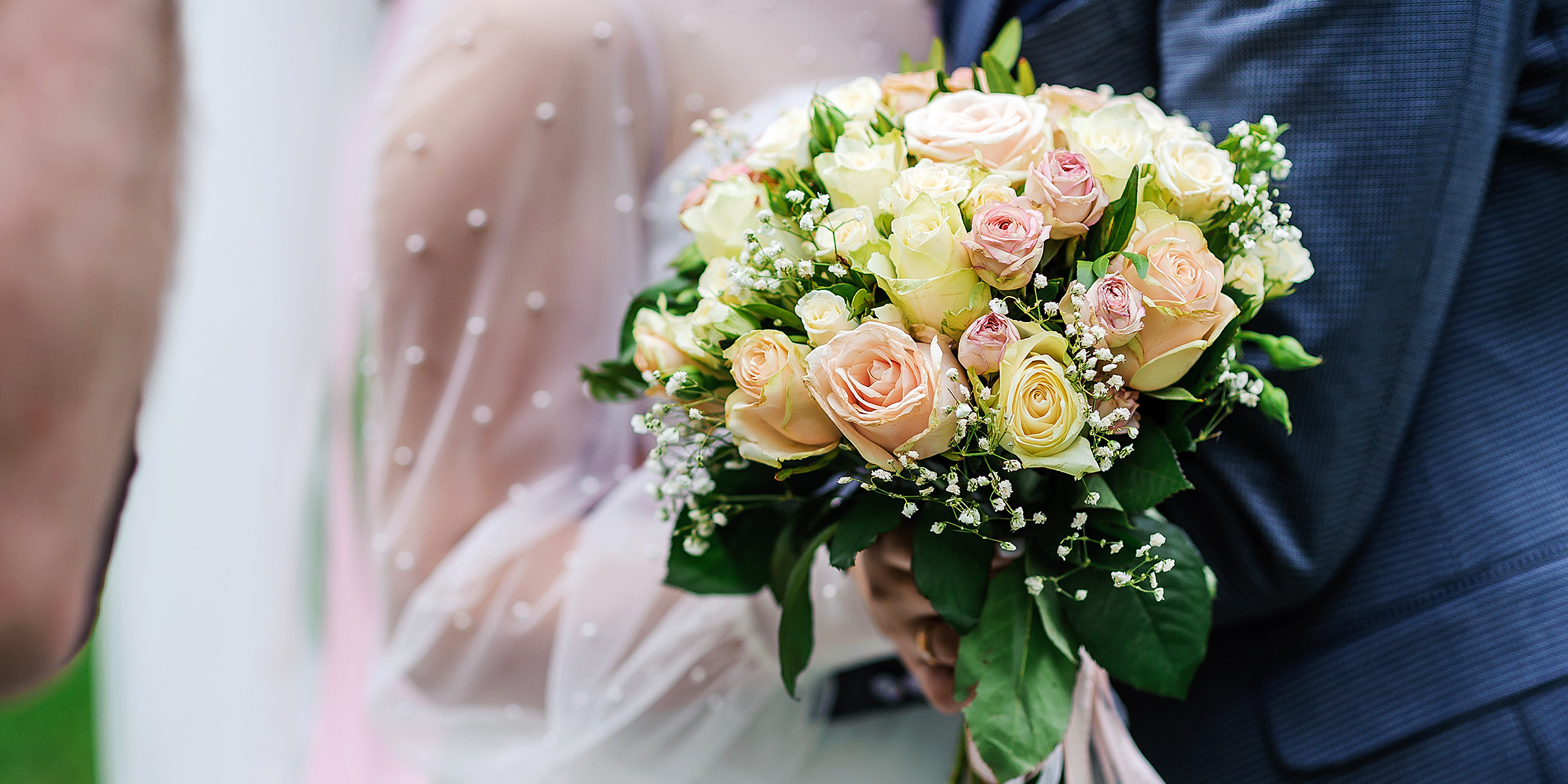 A person holding a bouquet of flowers | Source: Shutterstock