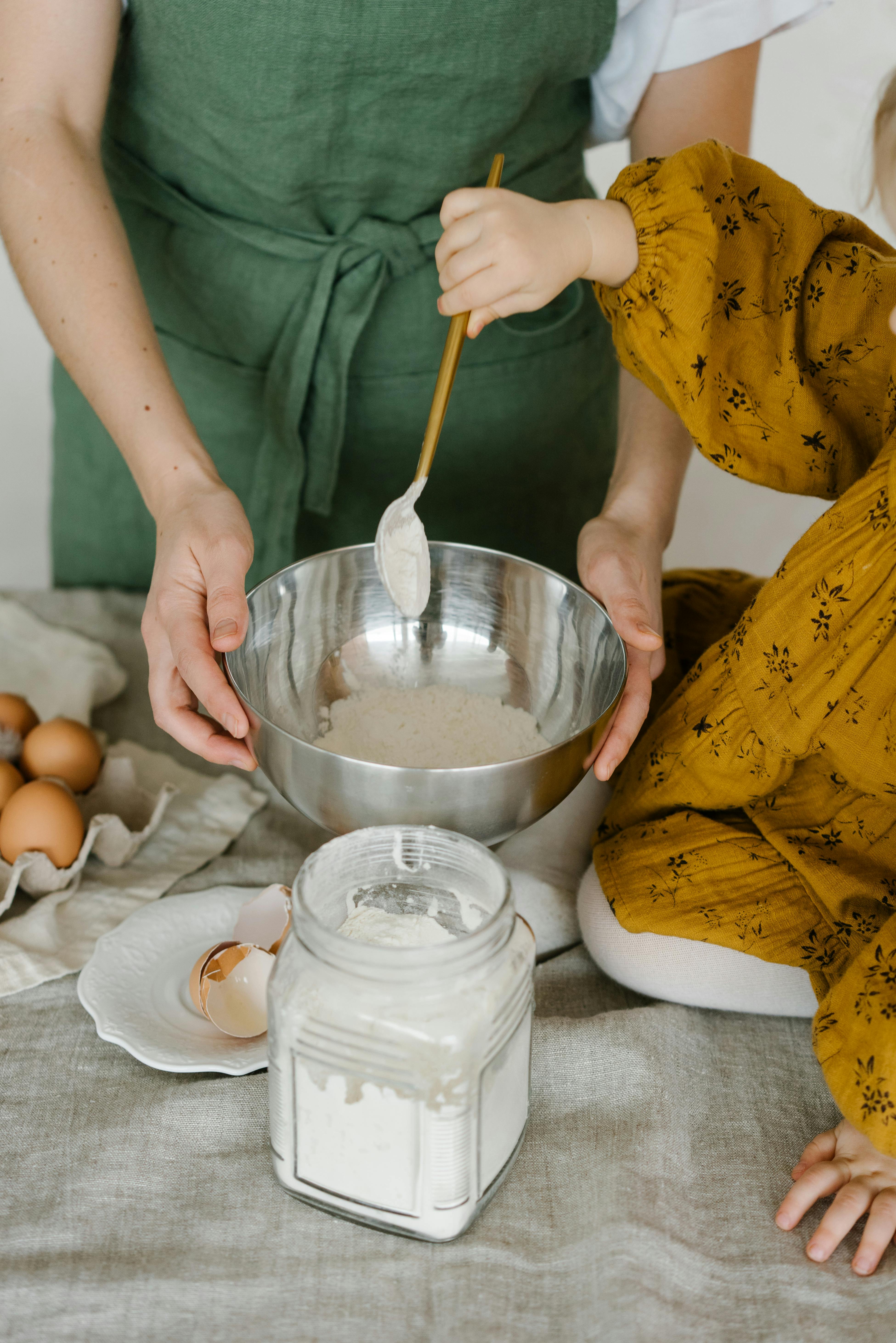 A mother baking with her daughter | Source: Pexels