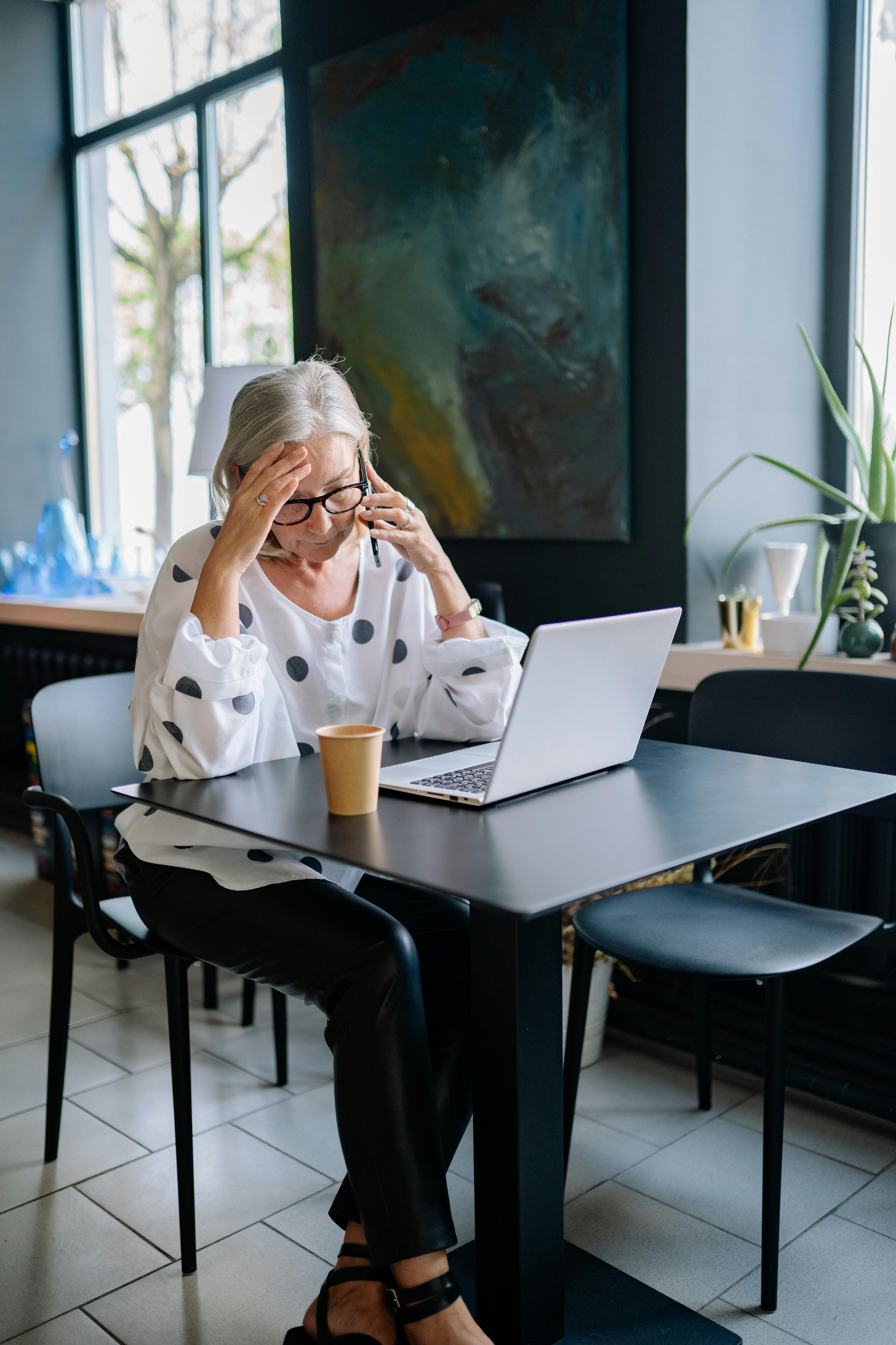 A stressed woman on a phone call | Source: Pexels