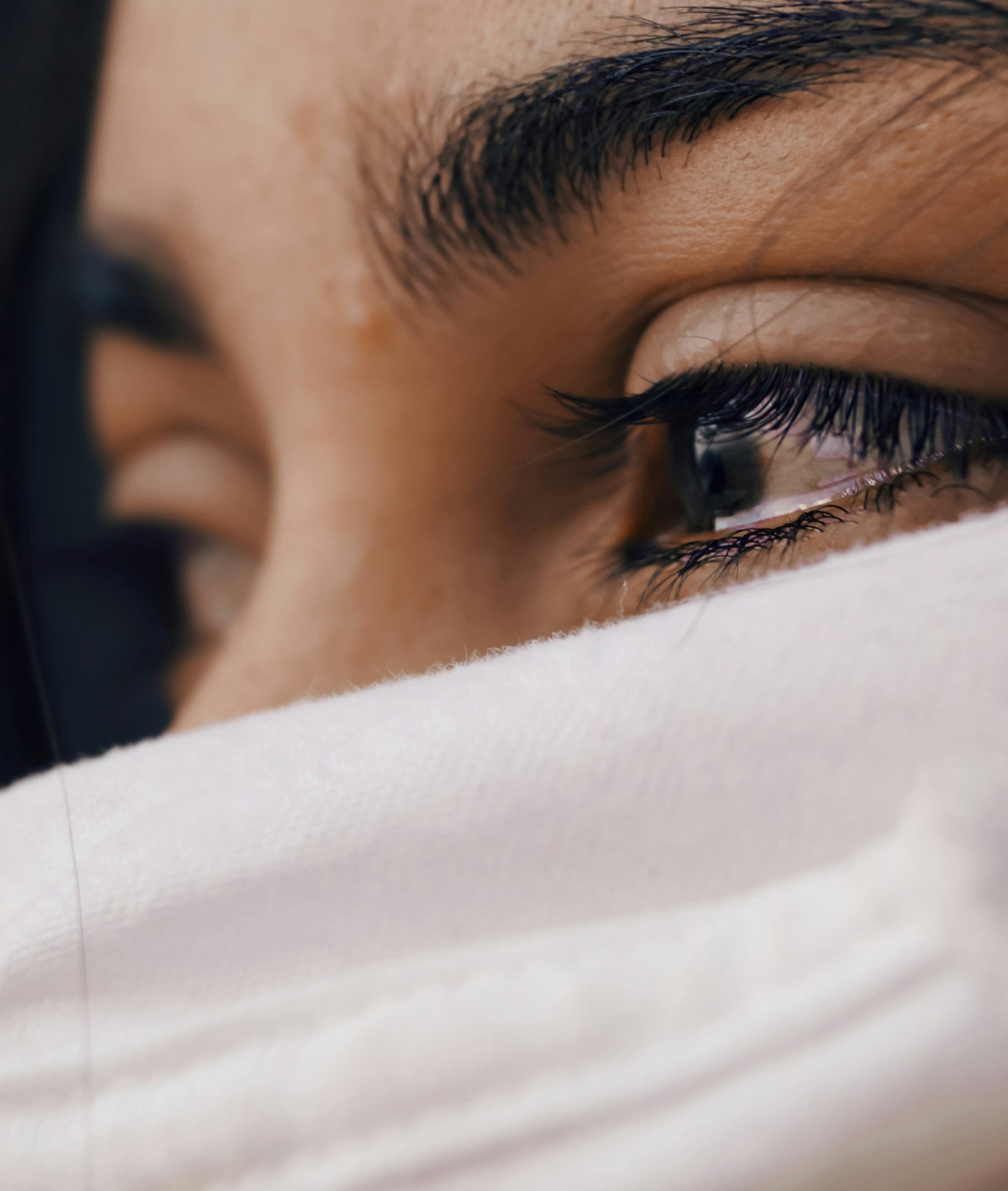 A teary-eyed woman | Source: Unsplash