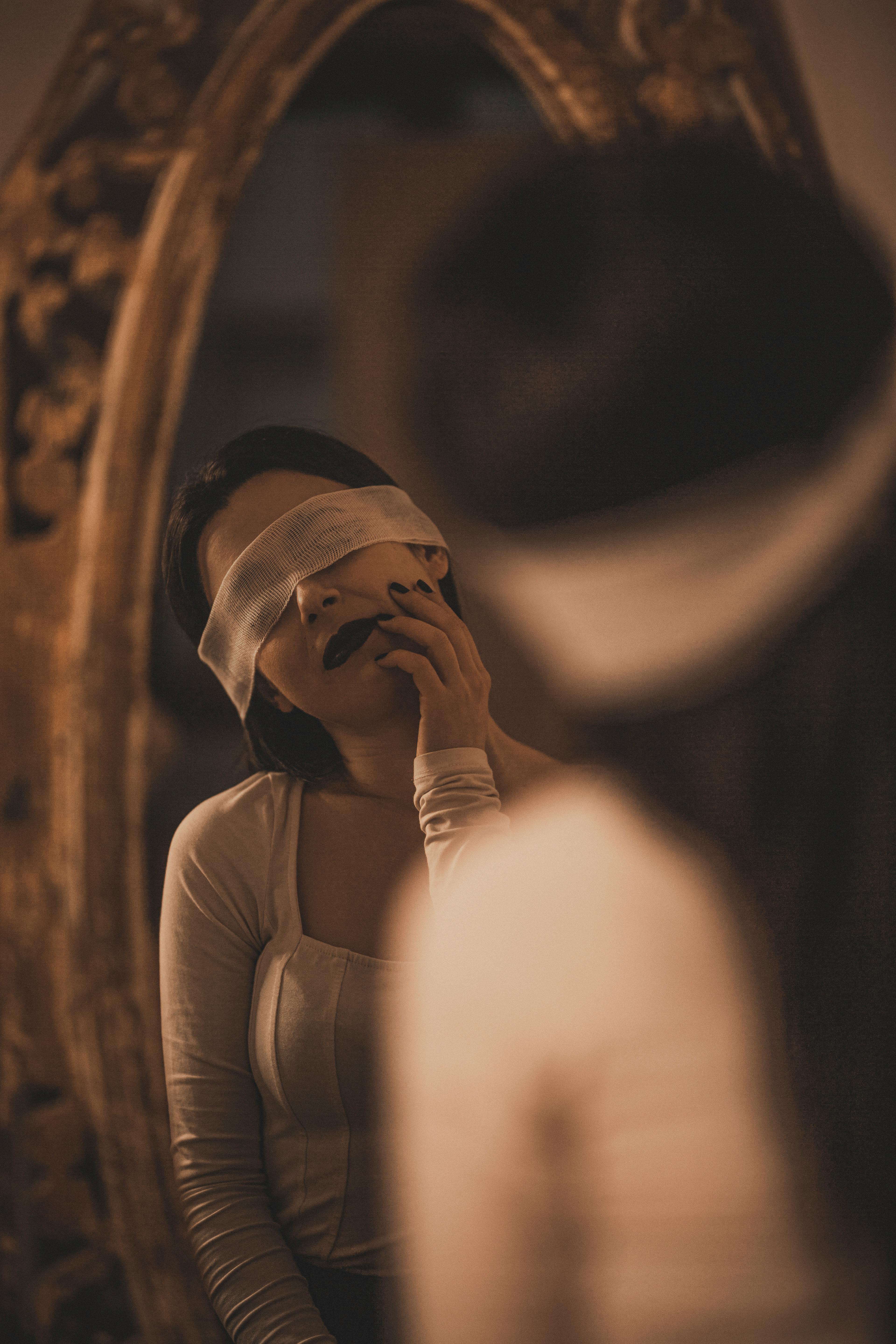 Woman gasping while blindfolded | Source: Pexels