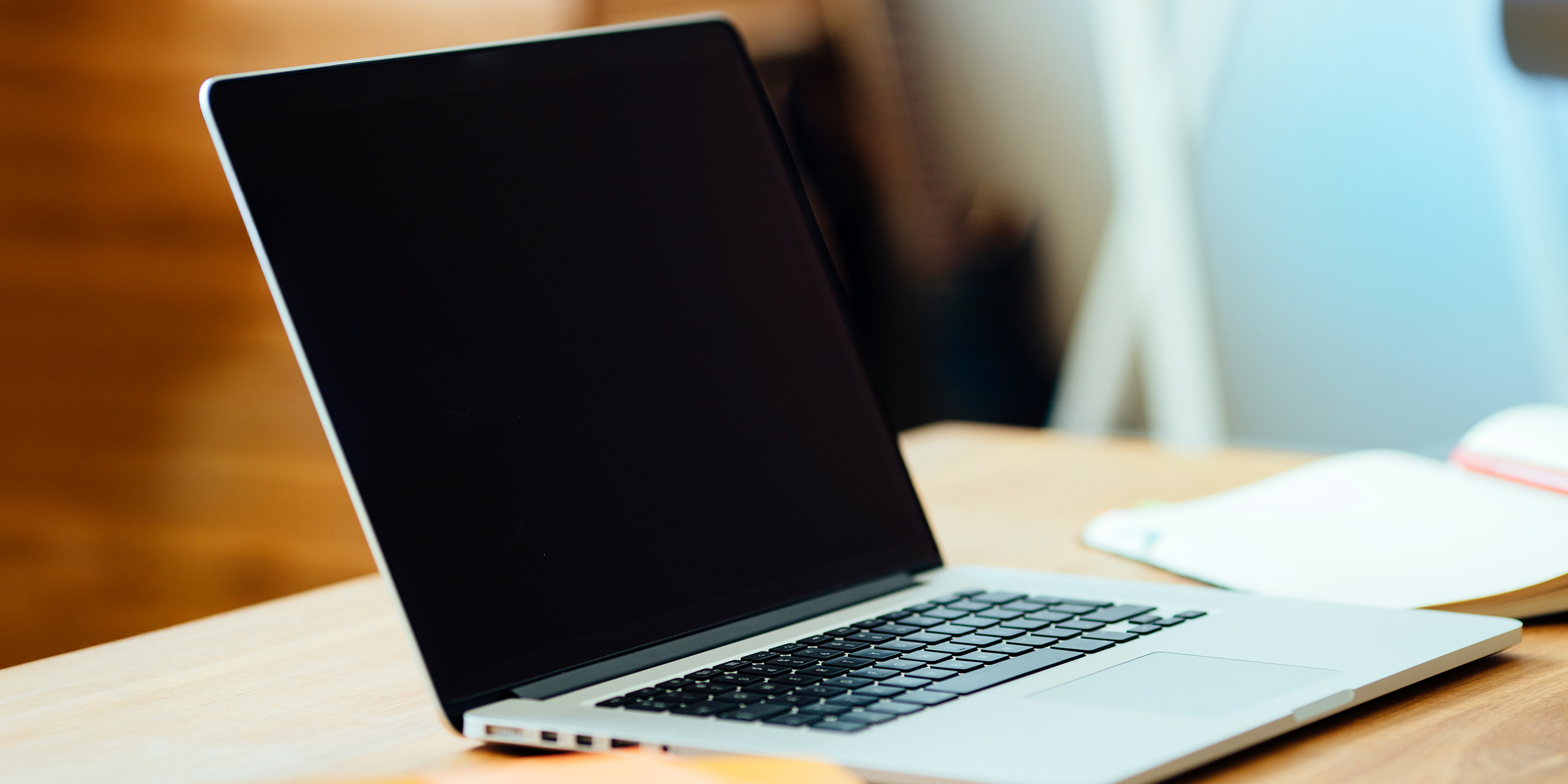 A laptop on a table | Source: Shutterstock