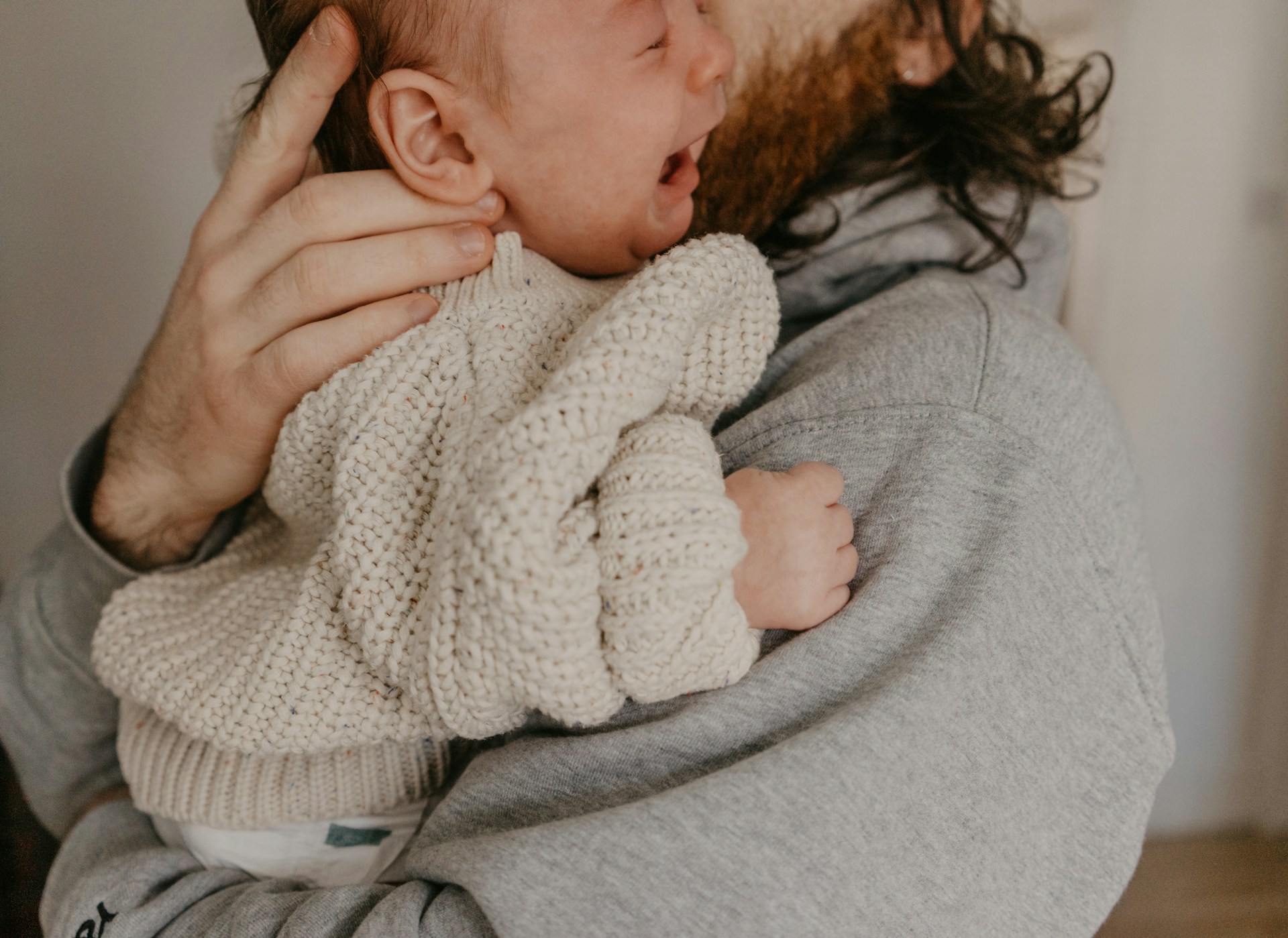 A man holding a baby | Source: Unsplash