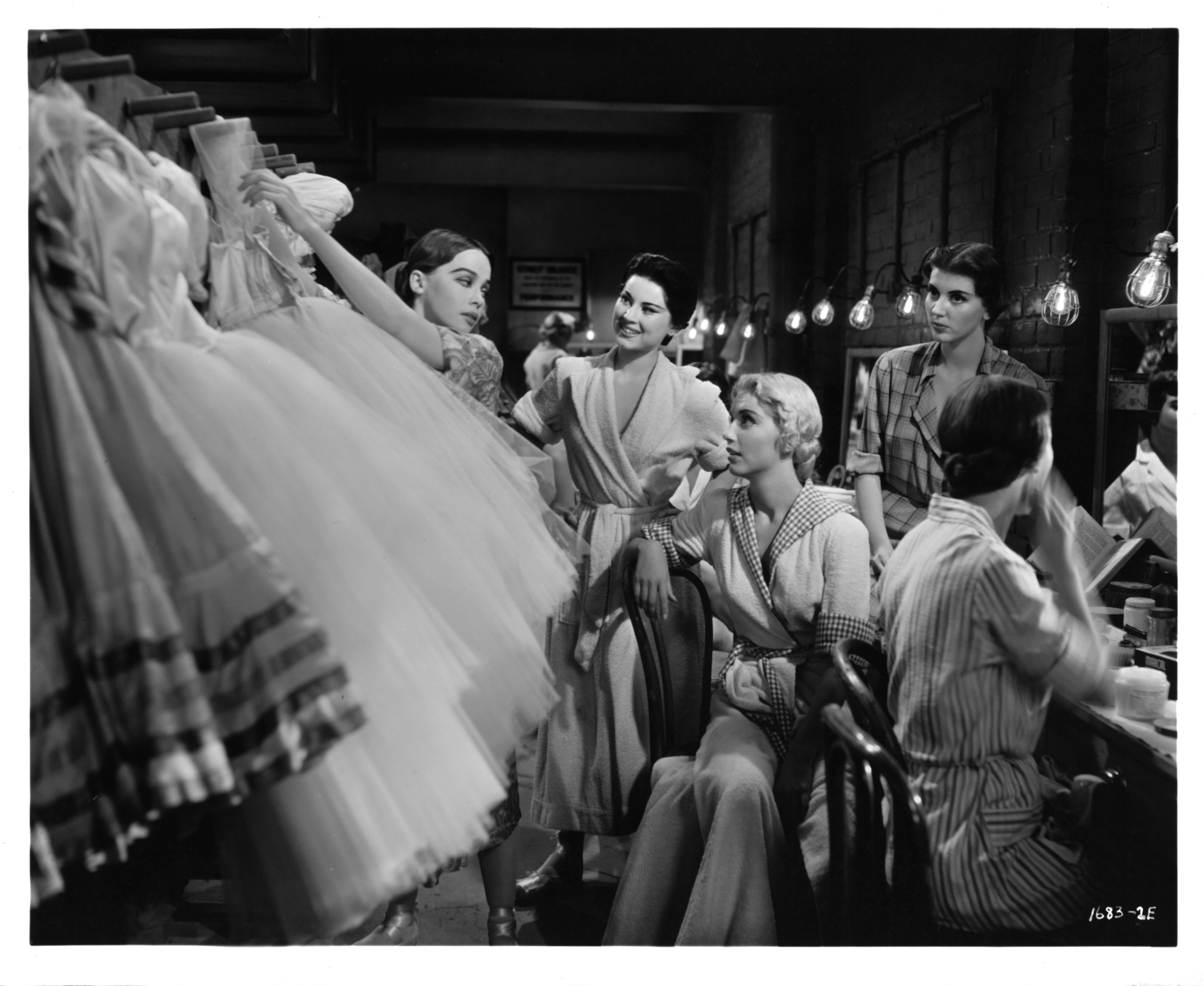 The actress and fellow actors exchange confidences in a scene from the film "Gaby," circa 1956 | Source: Getty Images