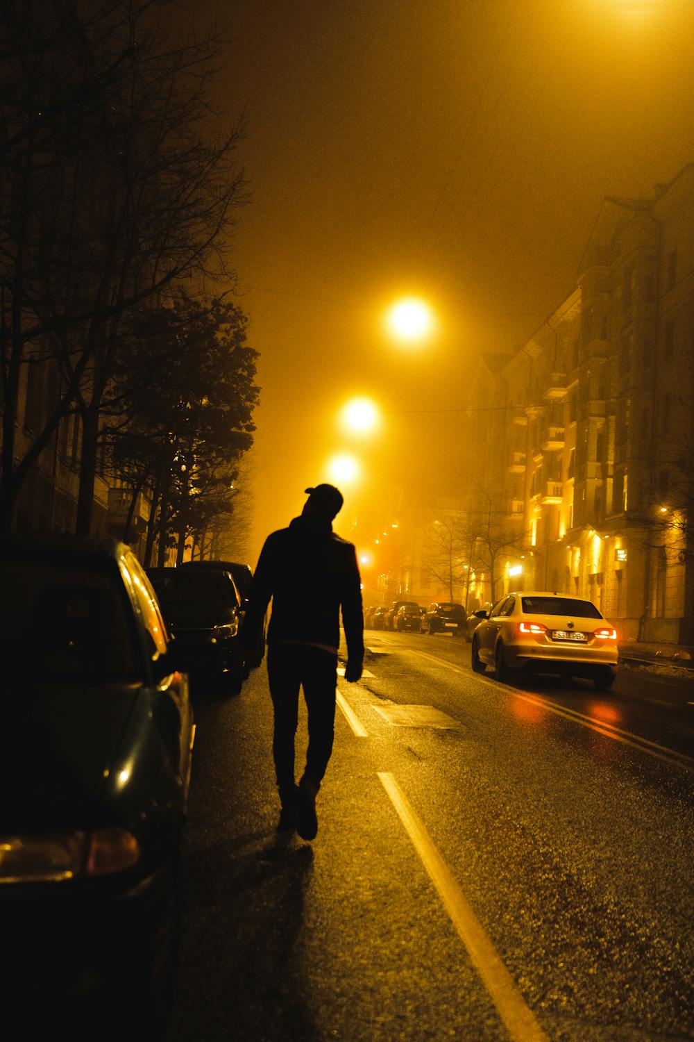 A man approaching a car at night | Source: Pexels