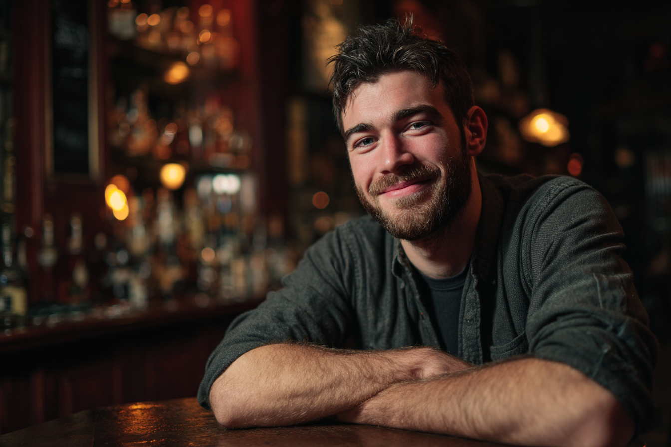 A man in a bar smiling at someone | Source: Midjourney