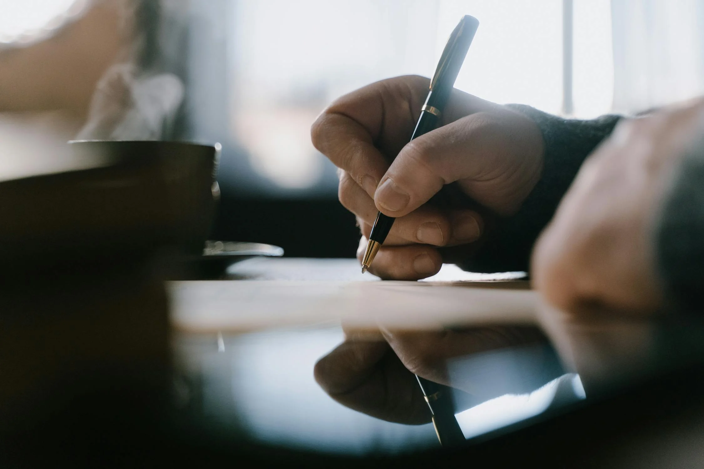 A man writing | Source: Pexels