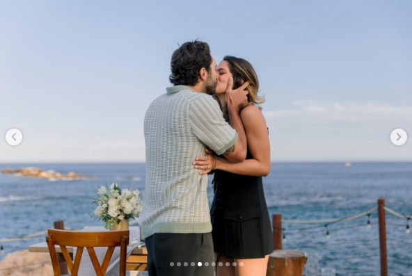 Joey Graziadei and Kelsey Anderson shared a kiss during their second engagement celebration in Cabo San Lucas in a post dated May 26, 2026. | Source: Instagram/joeygraziadei