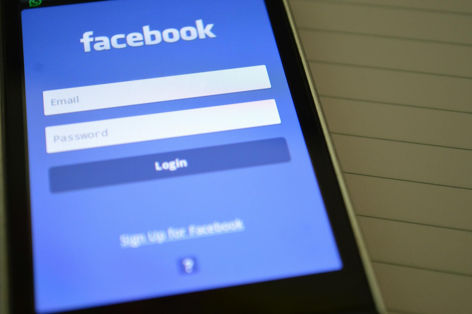 A phone showing the Facebook login page | Source: Pexels