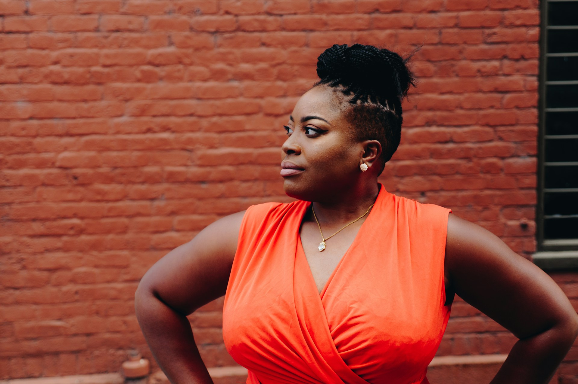 A woman standing with her hands on her hips | Source: Unsplash
