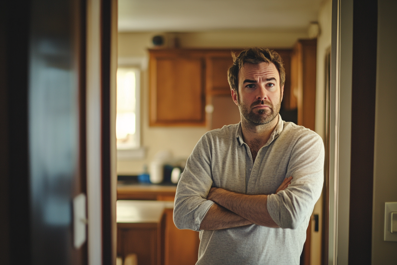 An angry man standing in a doorway | Source: Midjourney