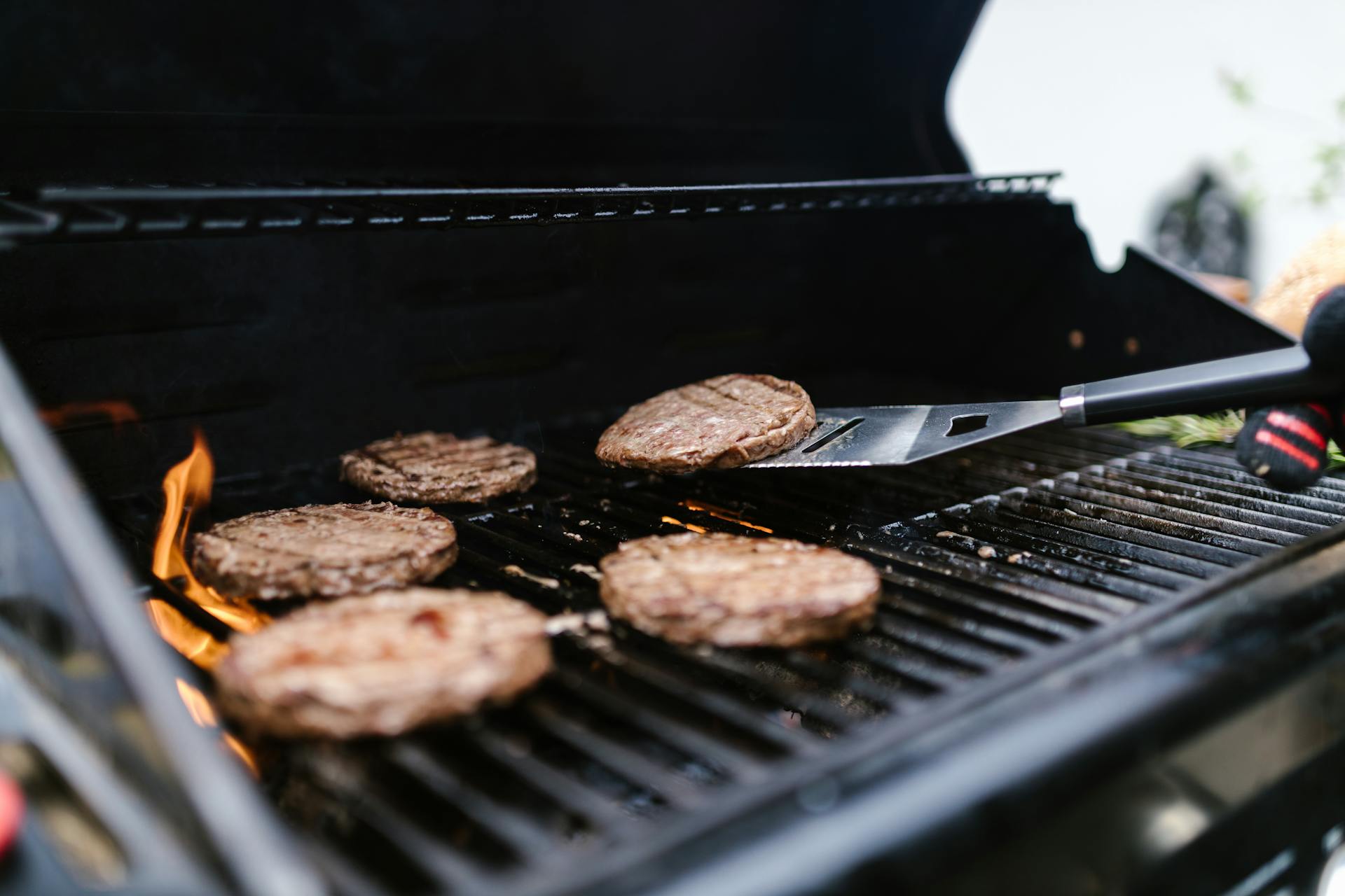 A close-up shot of grilling burgers | Source: Pexels