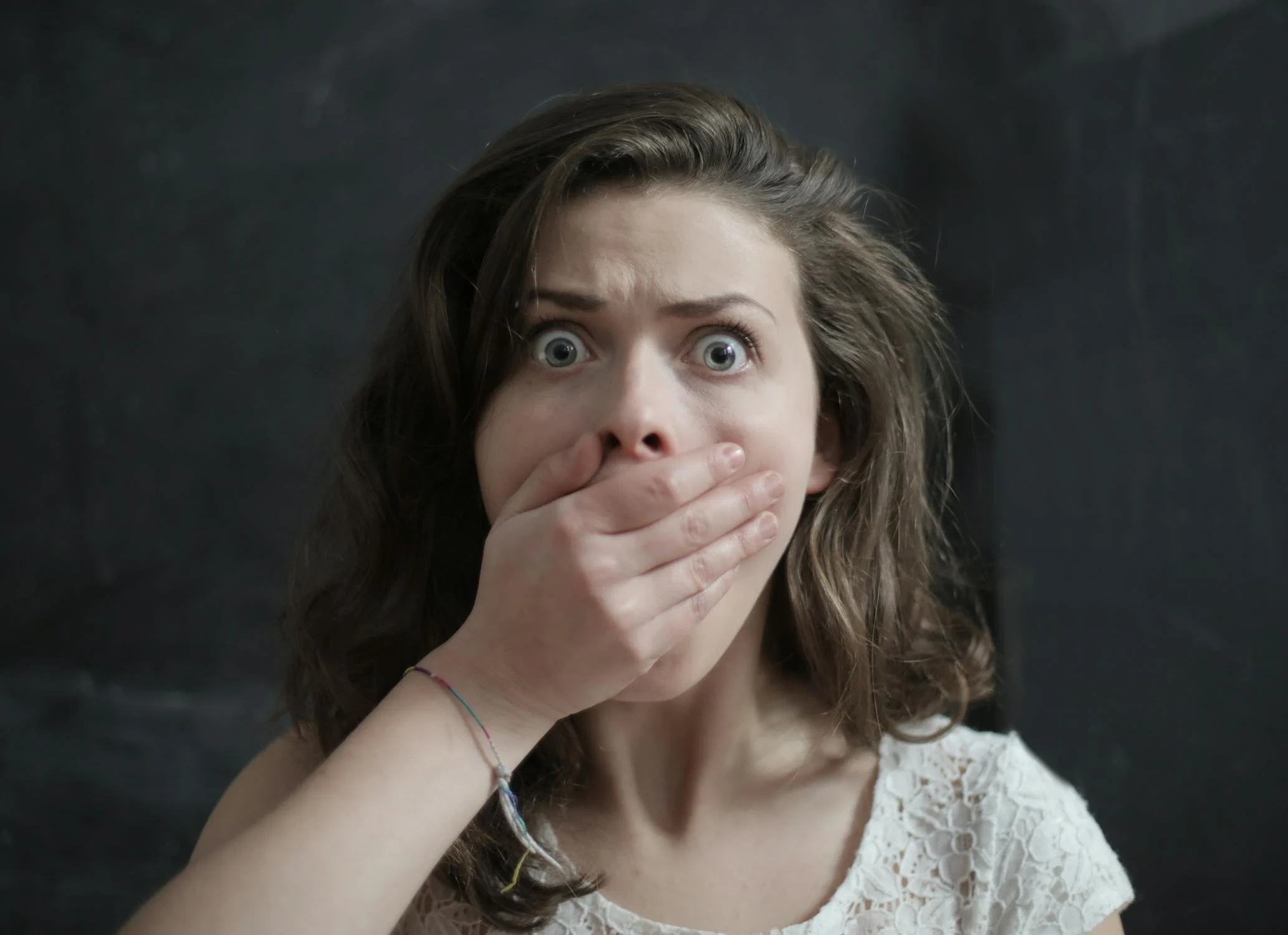 A shocked woman looking into the camera | Source: Pexels