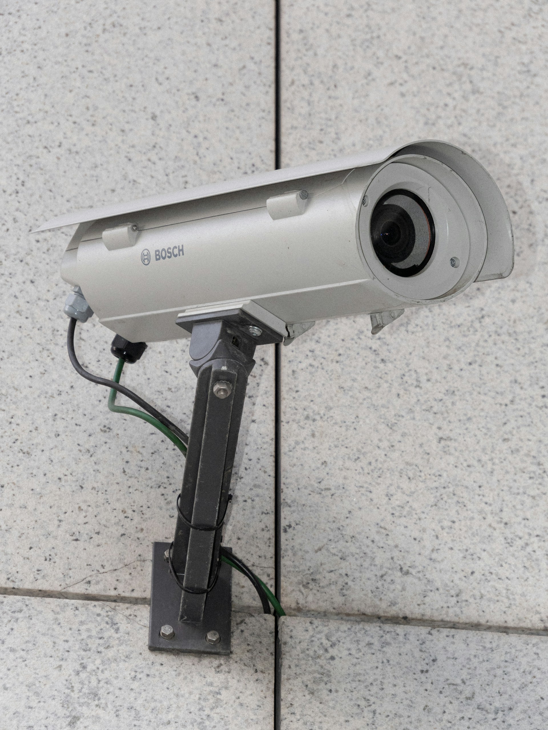 A surveillance camera mounted on the wall | Source: Unsplash