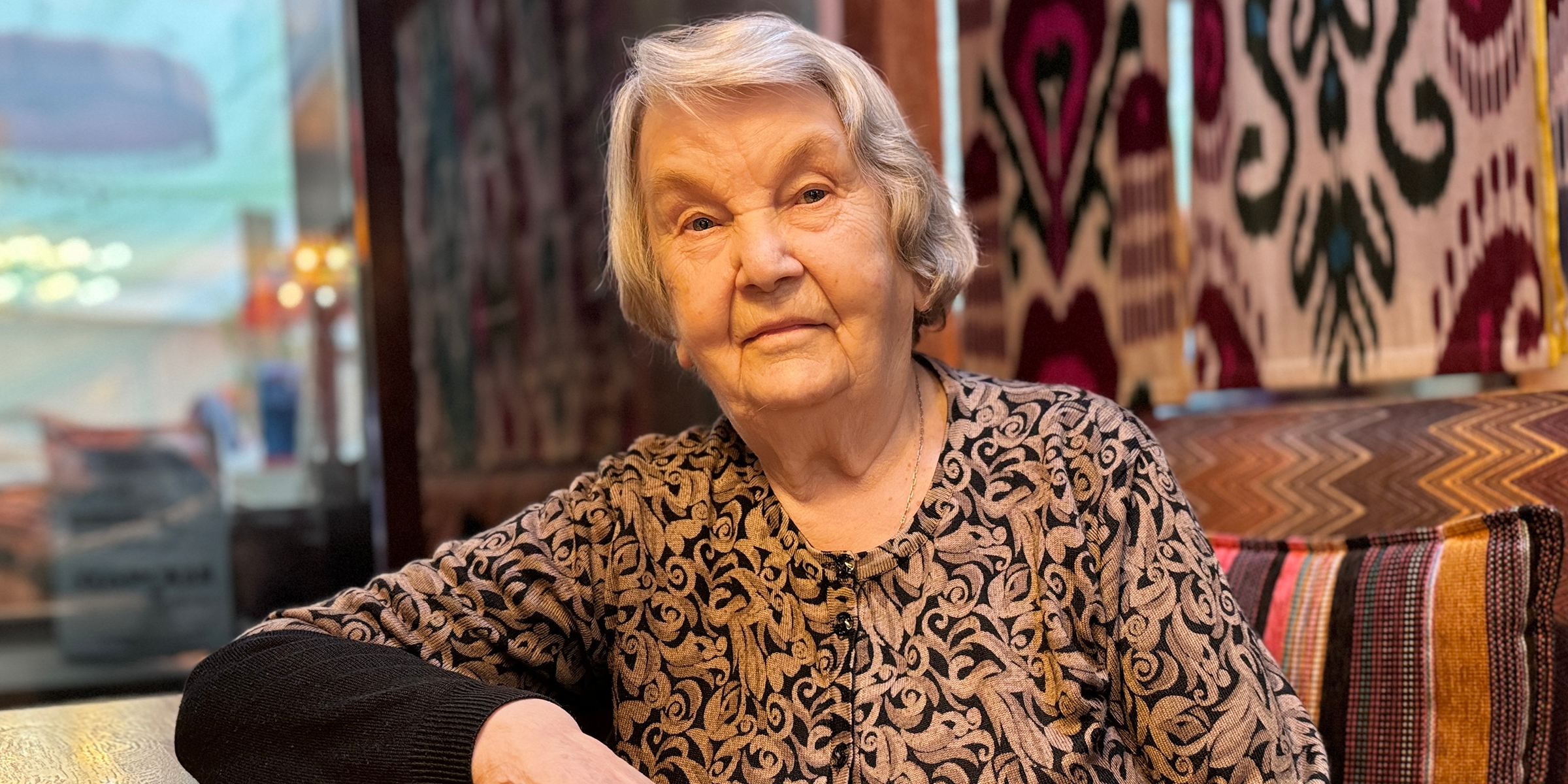 An elderly woman in a restaurant | Source: Midjourney