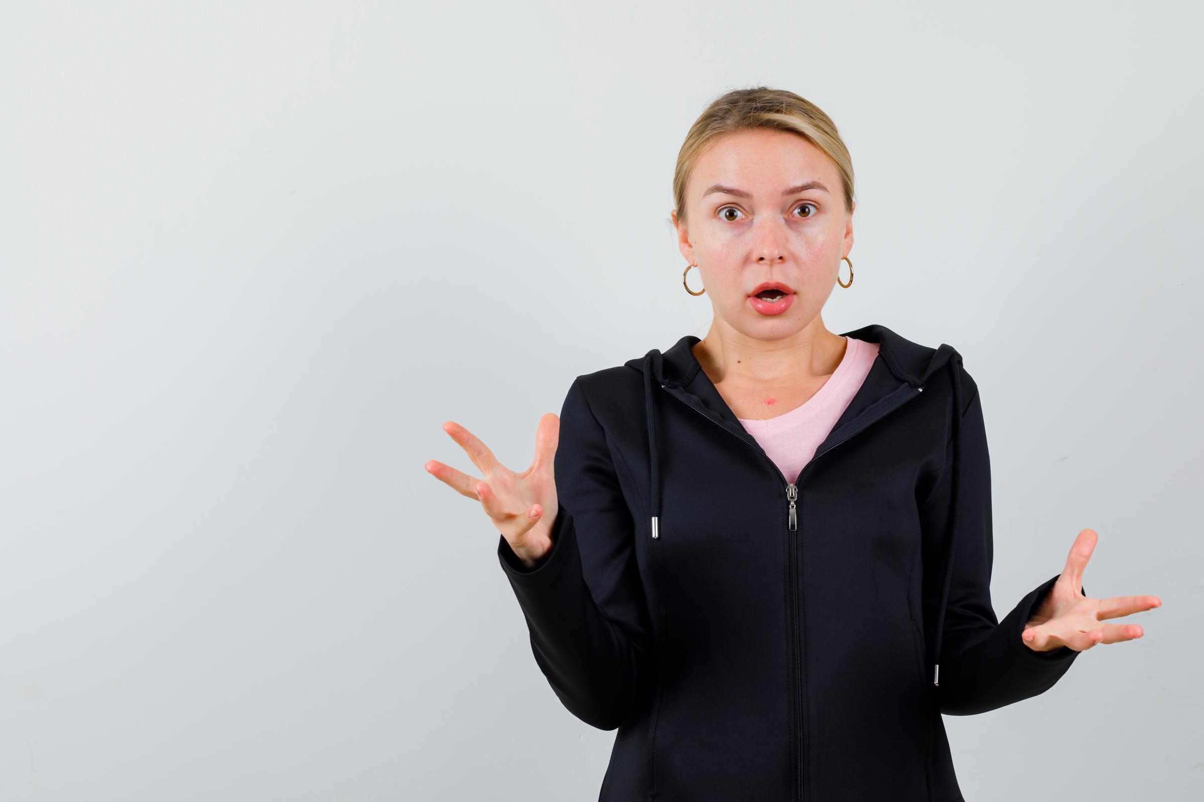 A shocked woman | Source: Freepik