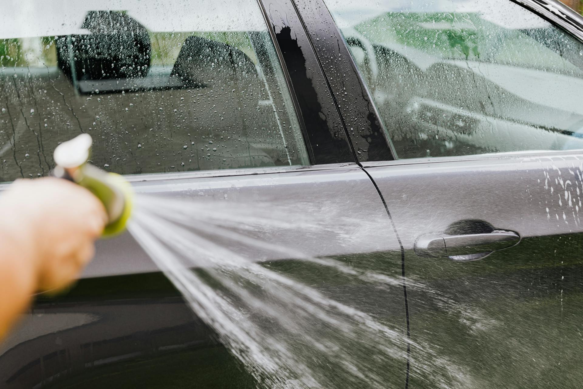 A man washing his car | Source: Pexels