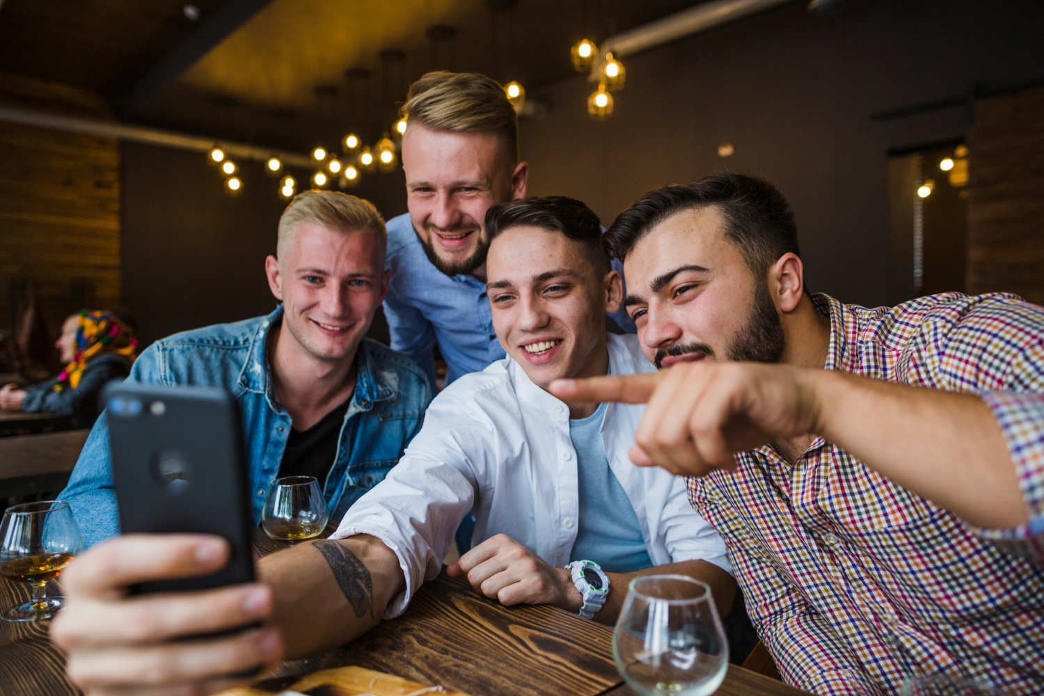 A group of men taking a selfie | Source: Freepik