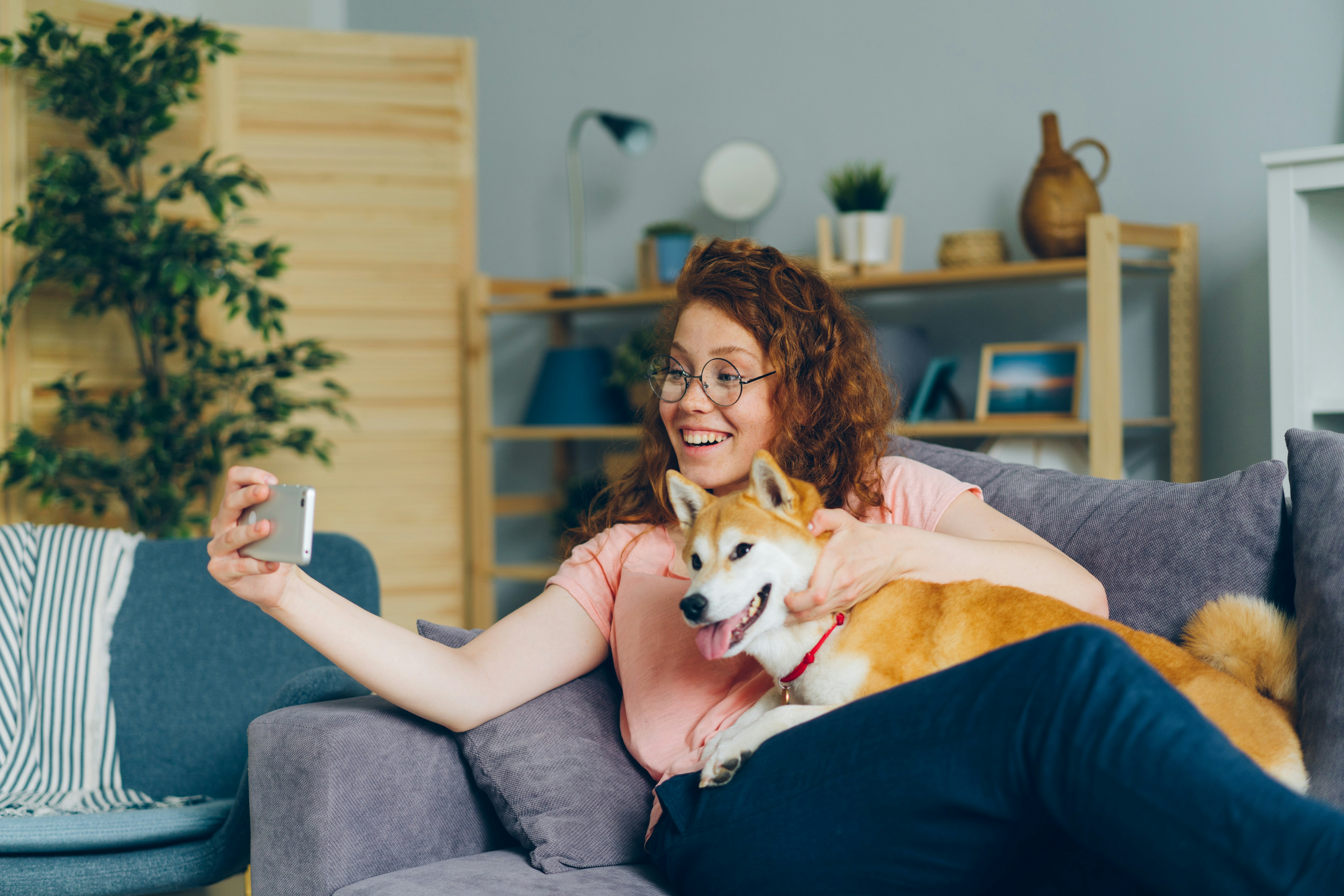A woman all happy with her dog | Source: Unsplash
