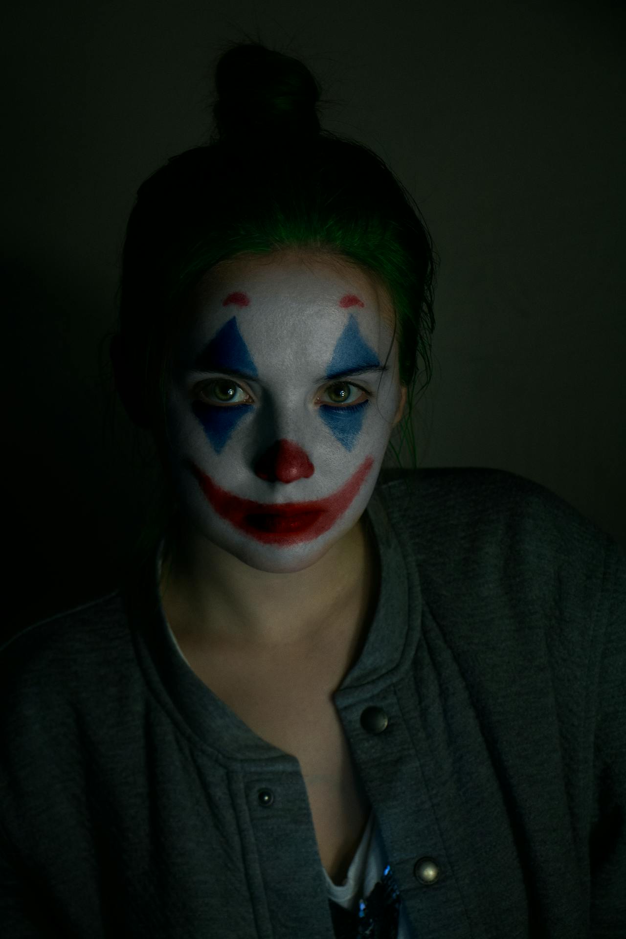 A frustrated woman with her face painted to resemble a clown | Source: Pexels