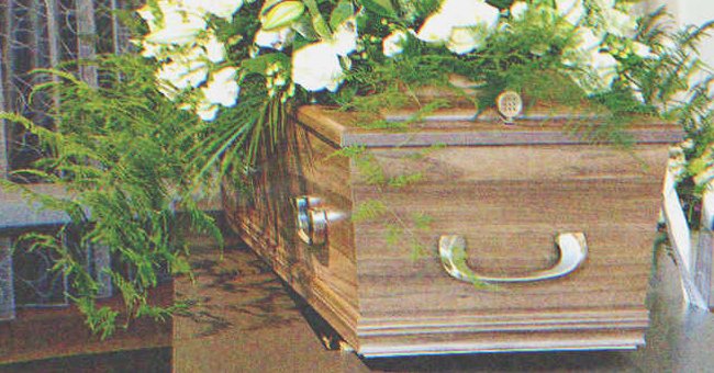 A coffin with flowers on it | Source: Shutterstock