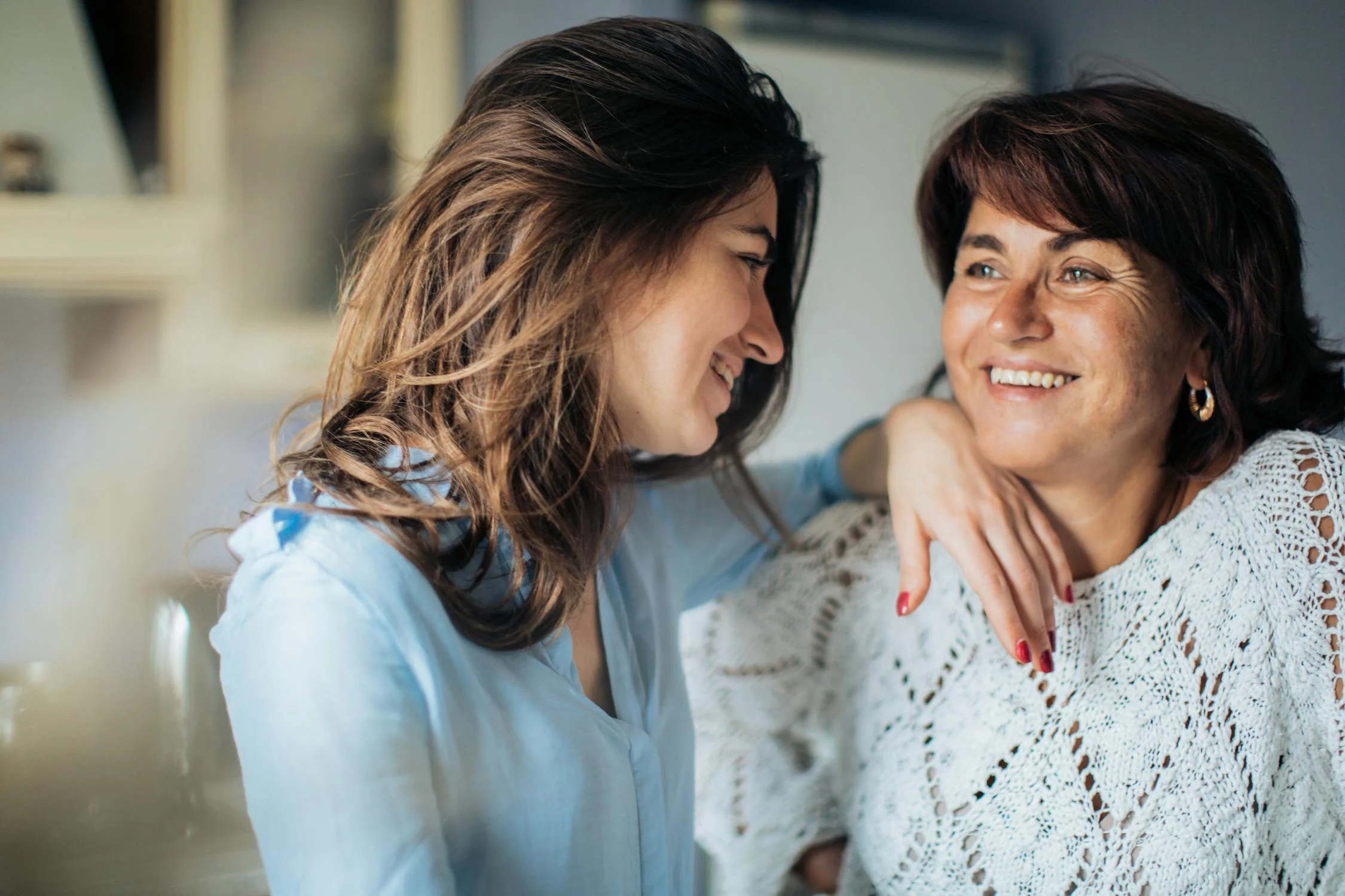 A smiling woman with her daughter | Source: Pexels