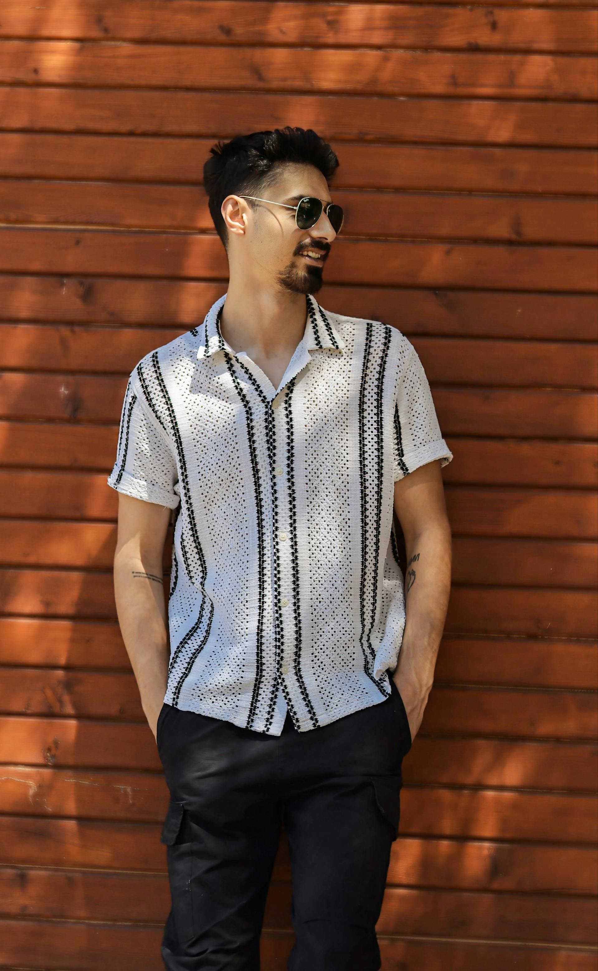 A man averting his gaze while smiling | Source: Pexels