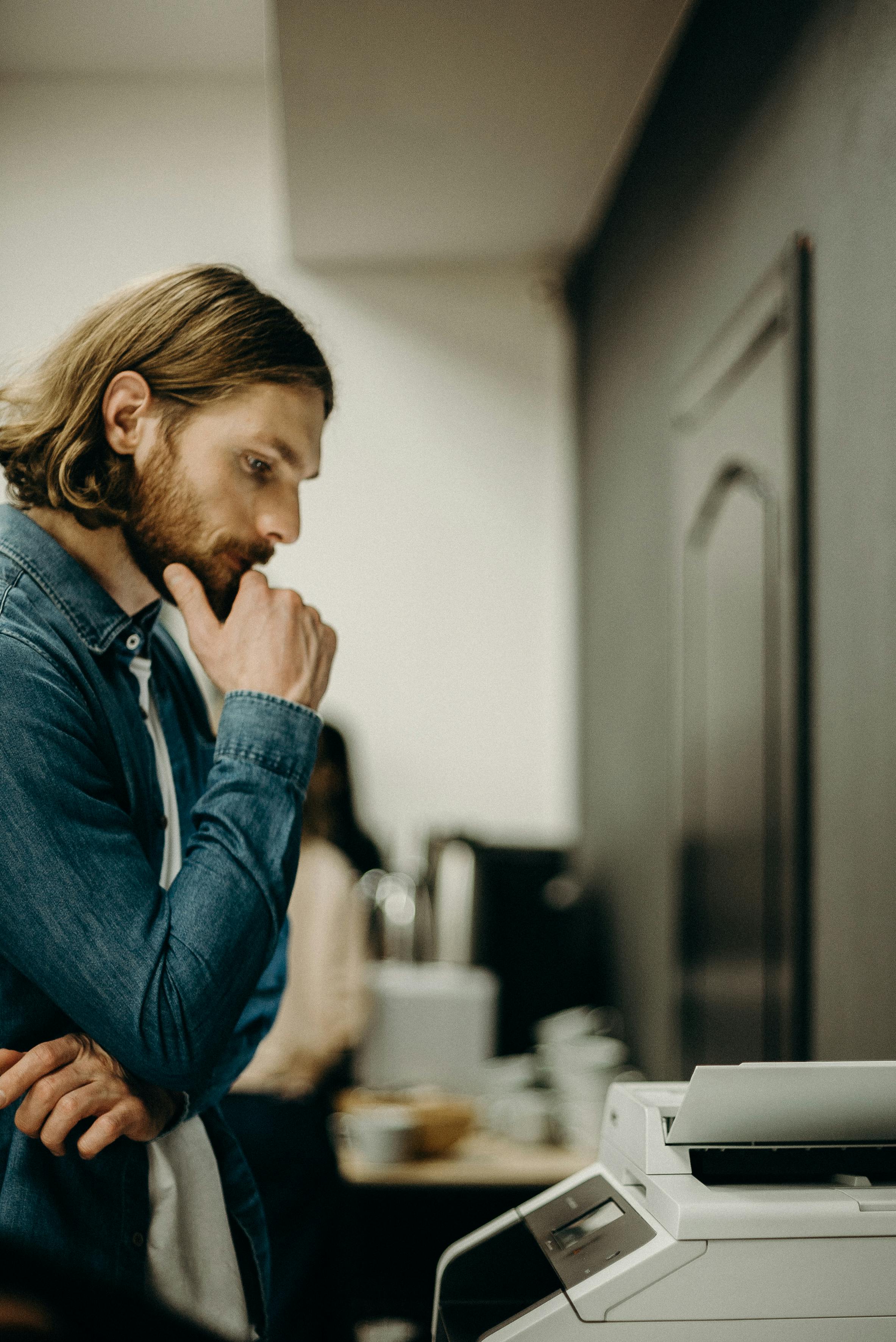 A man printing something | Source: Pexels