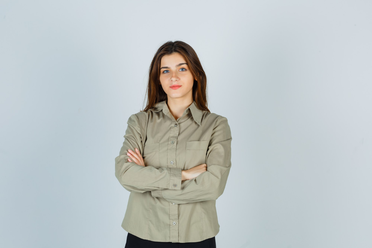 A confident woman with her arms crossed | Source: Freepik