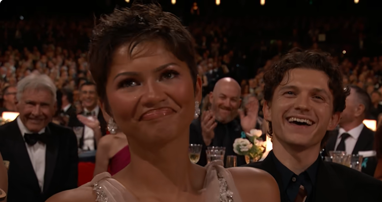Harrison Ford appears amused in the background as Zendaya reacts to Marcello Hernández during the 78th Primetime Emmy Awards. | Source: YouTube/NBC and Peacock