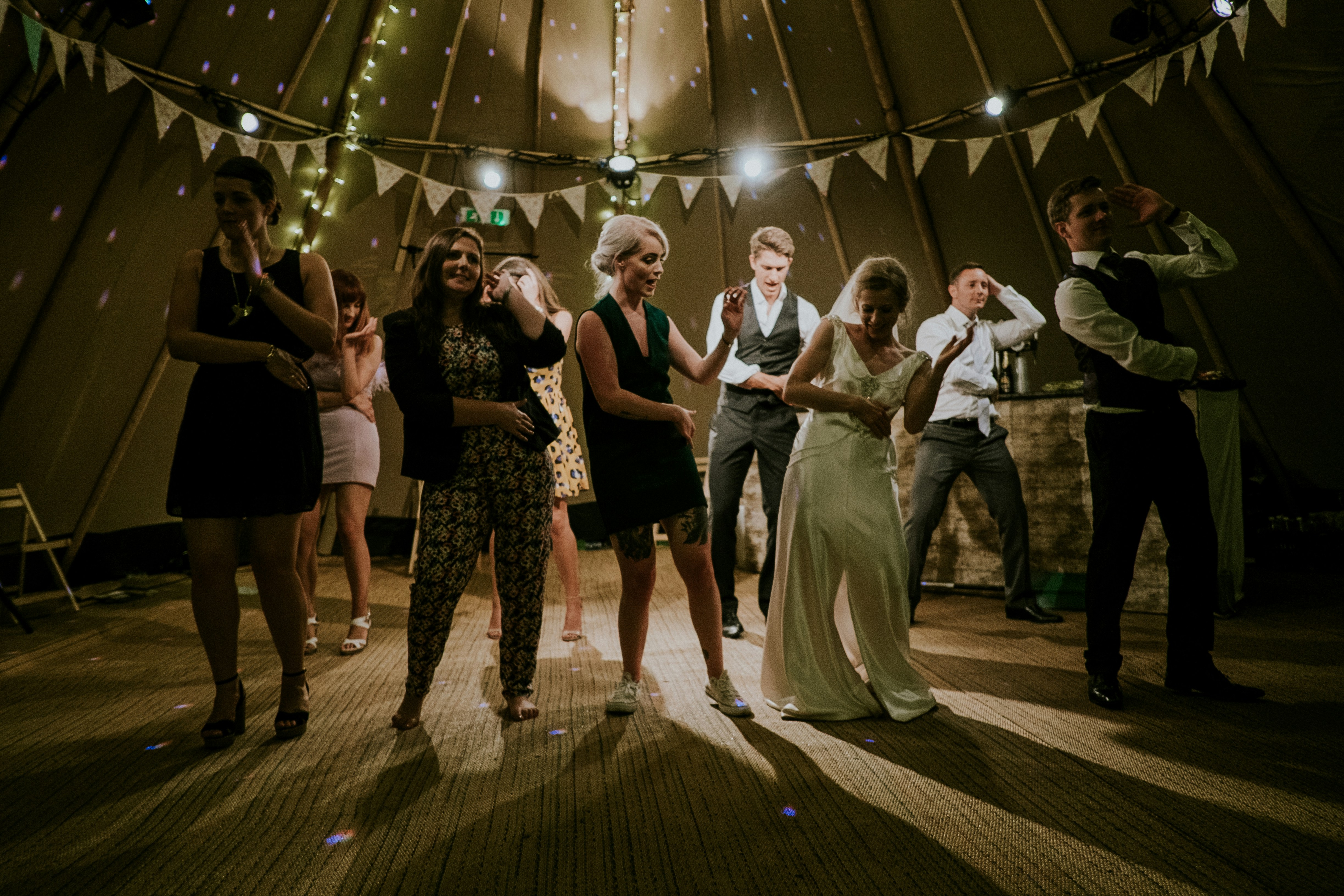 Newly weds with guests at a wedding reception | Source: Pexels