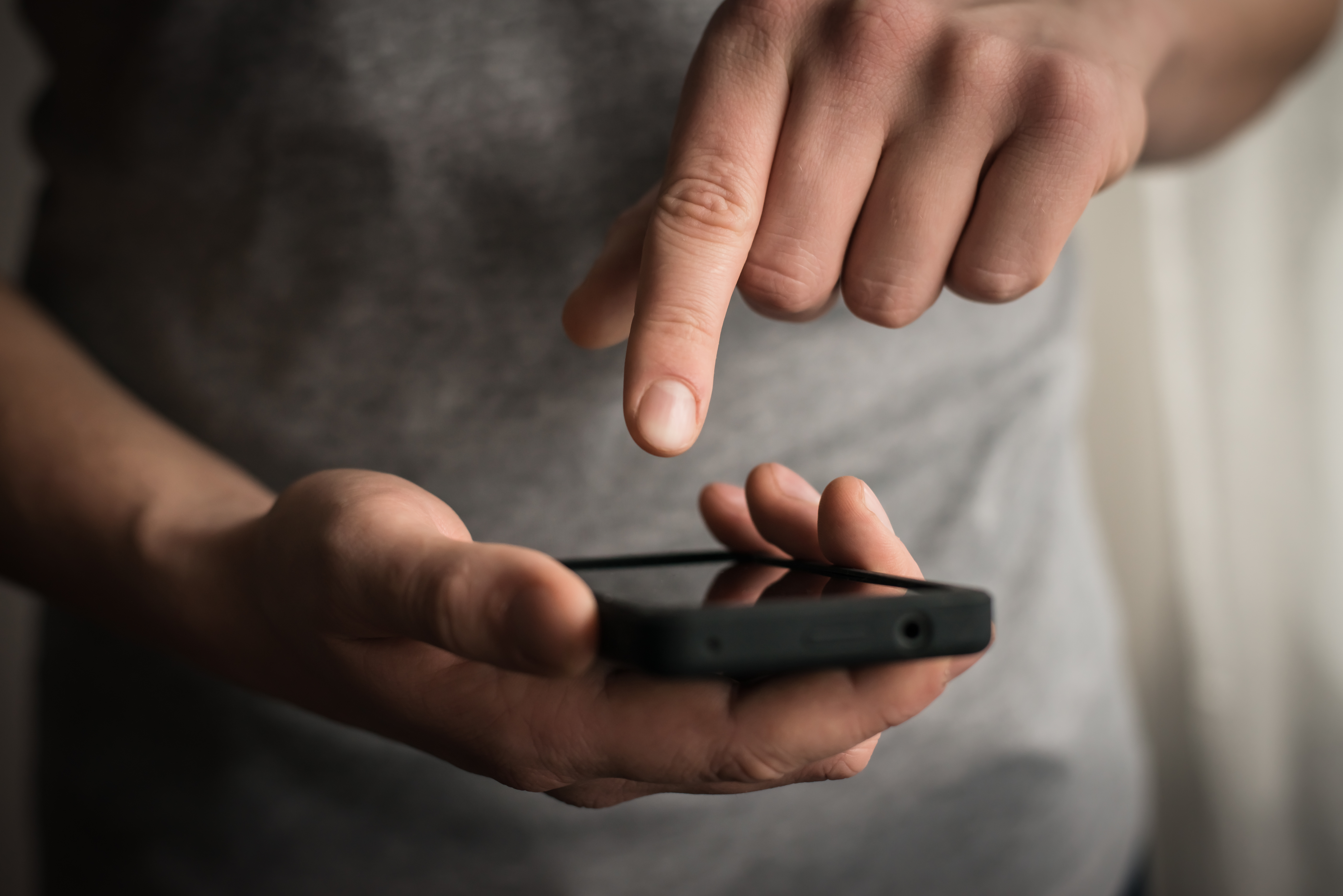 A man using a mobile phone | Source: Shutterstock