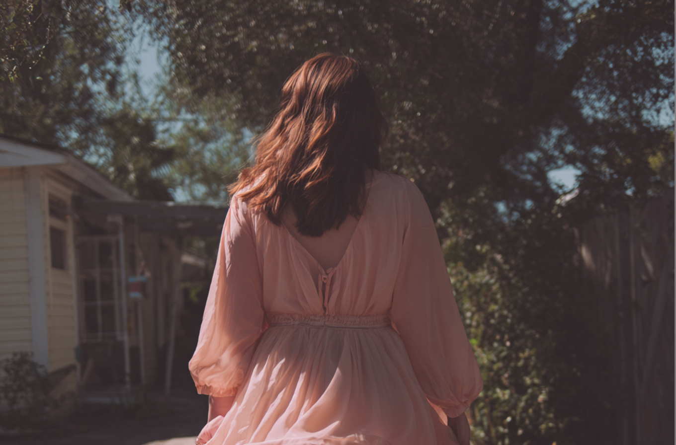 A woman walking away | Source: Midjourney
