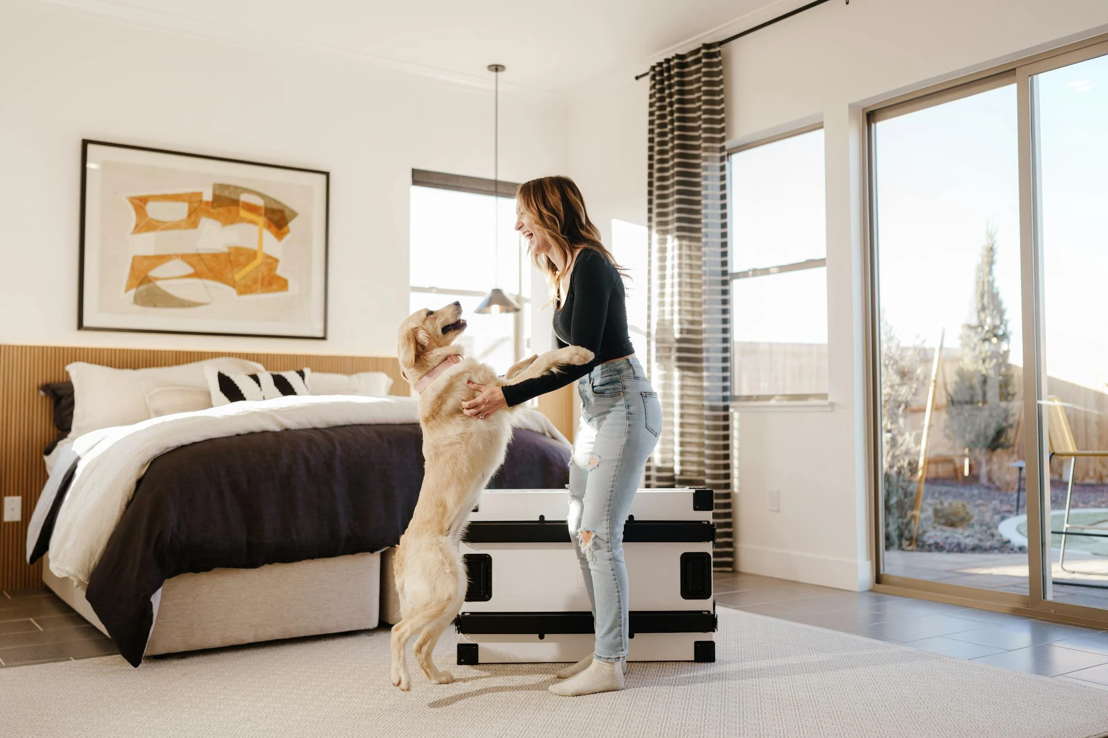 A happy woman dancing with her dog | Source: Pexels