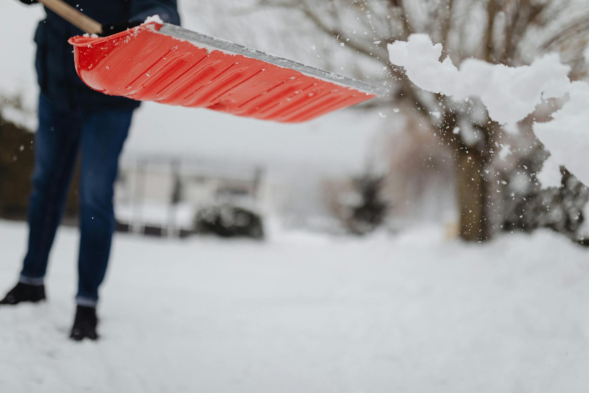 A person shoveling snow | Source: Pexels