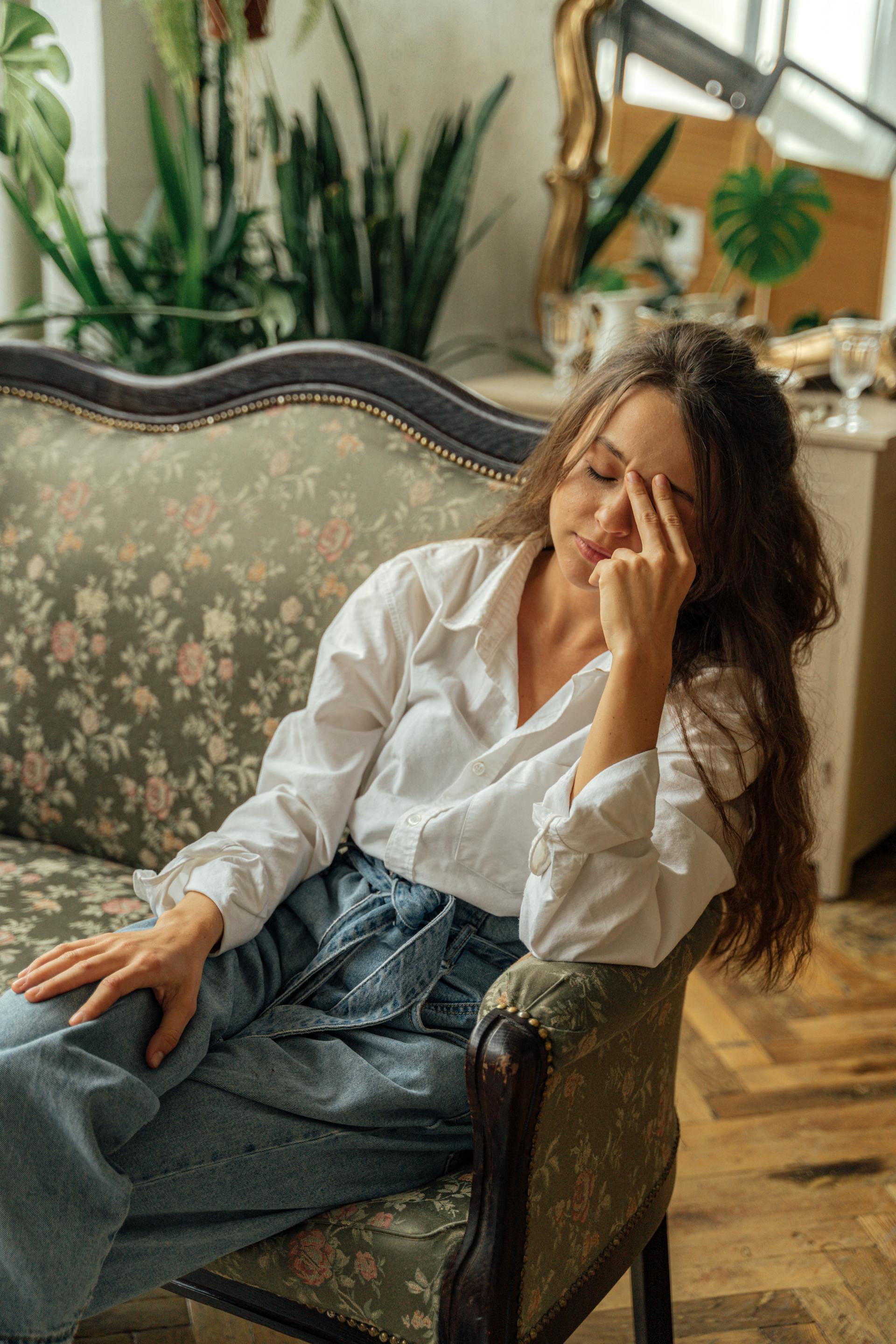 A tense woman on a sofa | Source: Pexels
