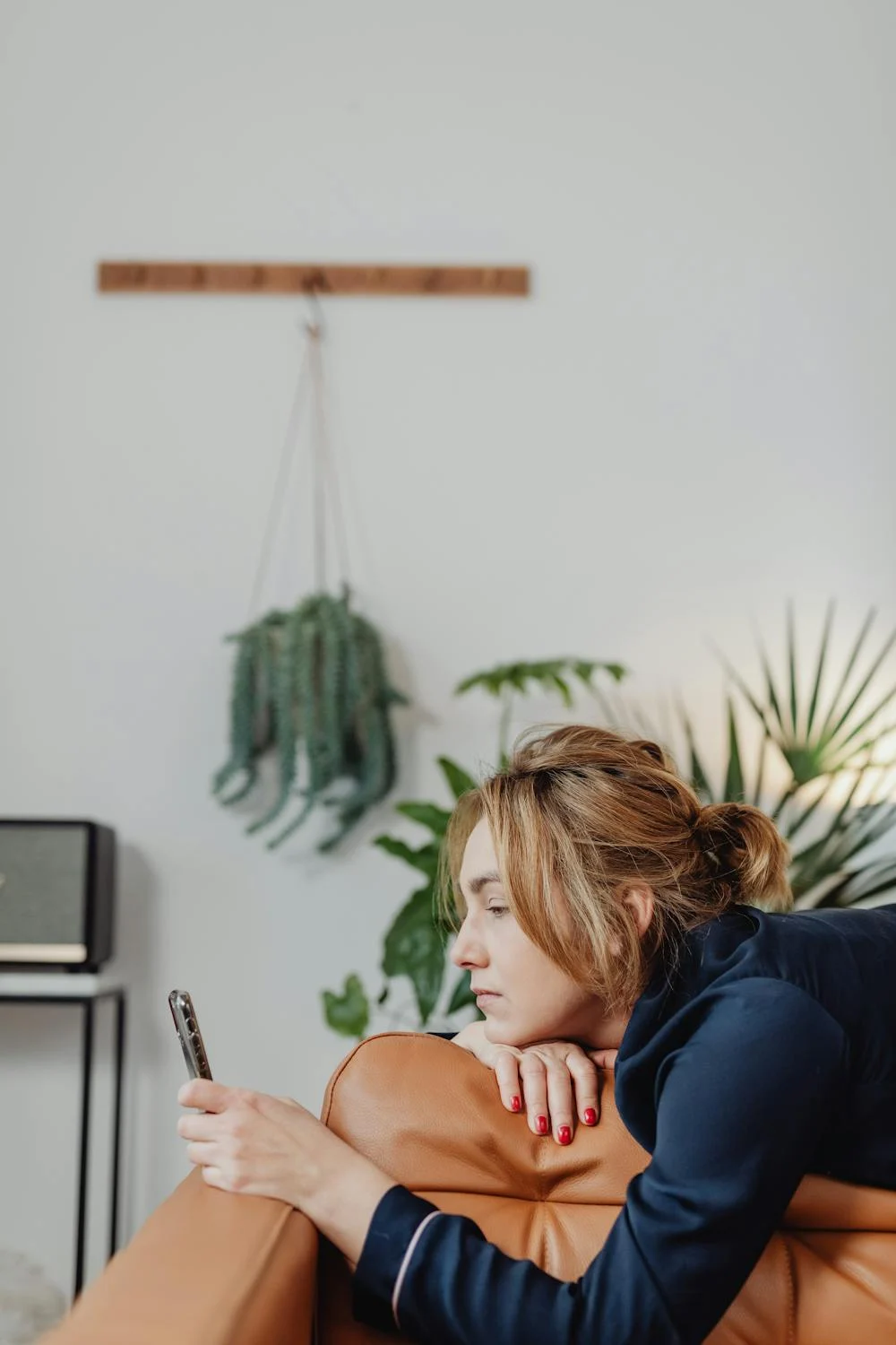 A woman looking at her phone | Source: Pexels