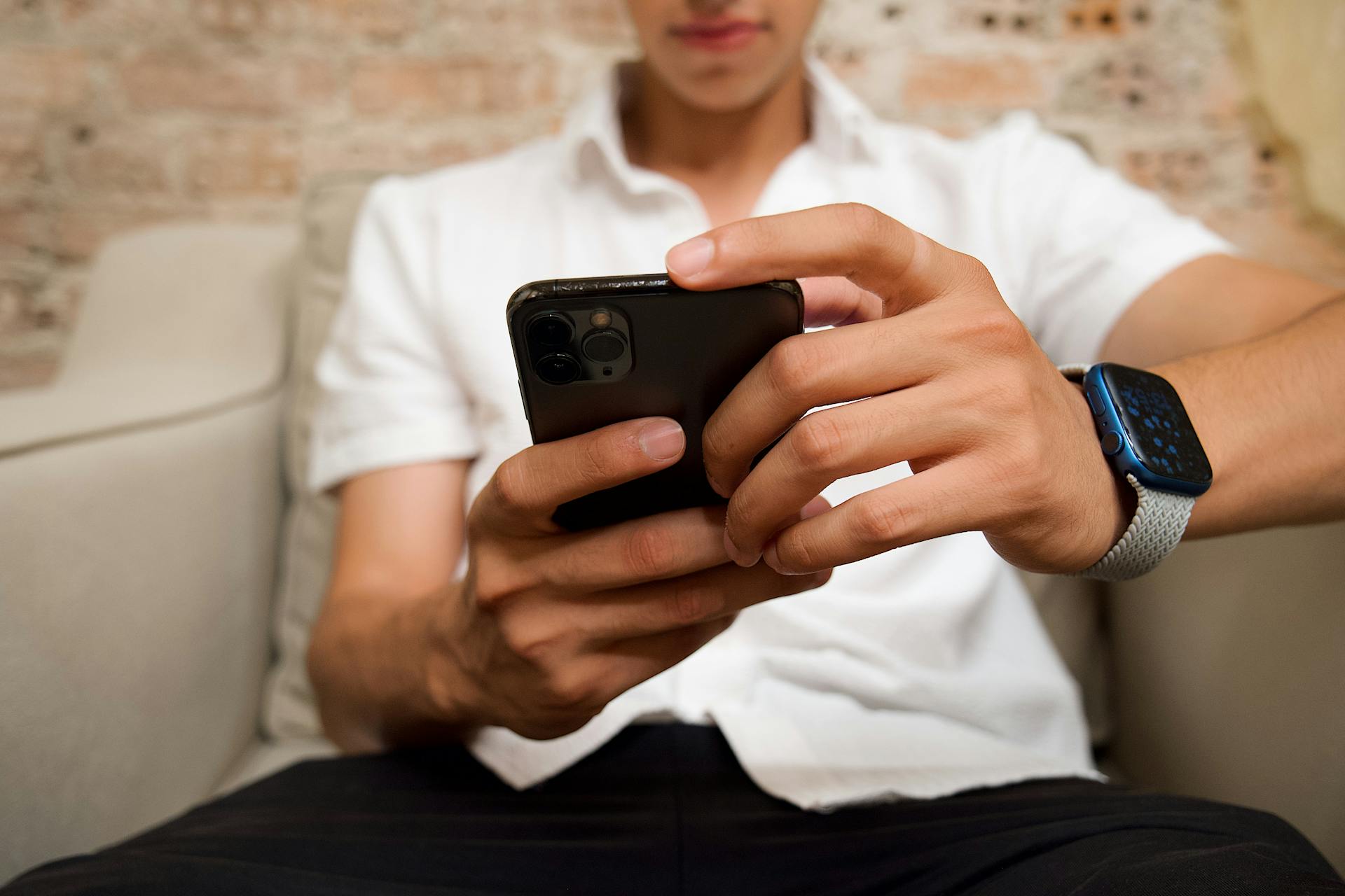 A young man checking his phone | Source: Pexels