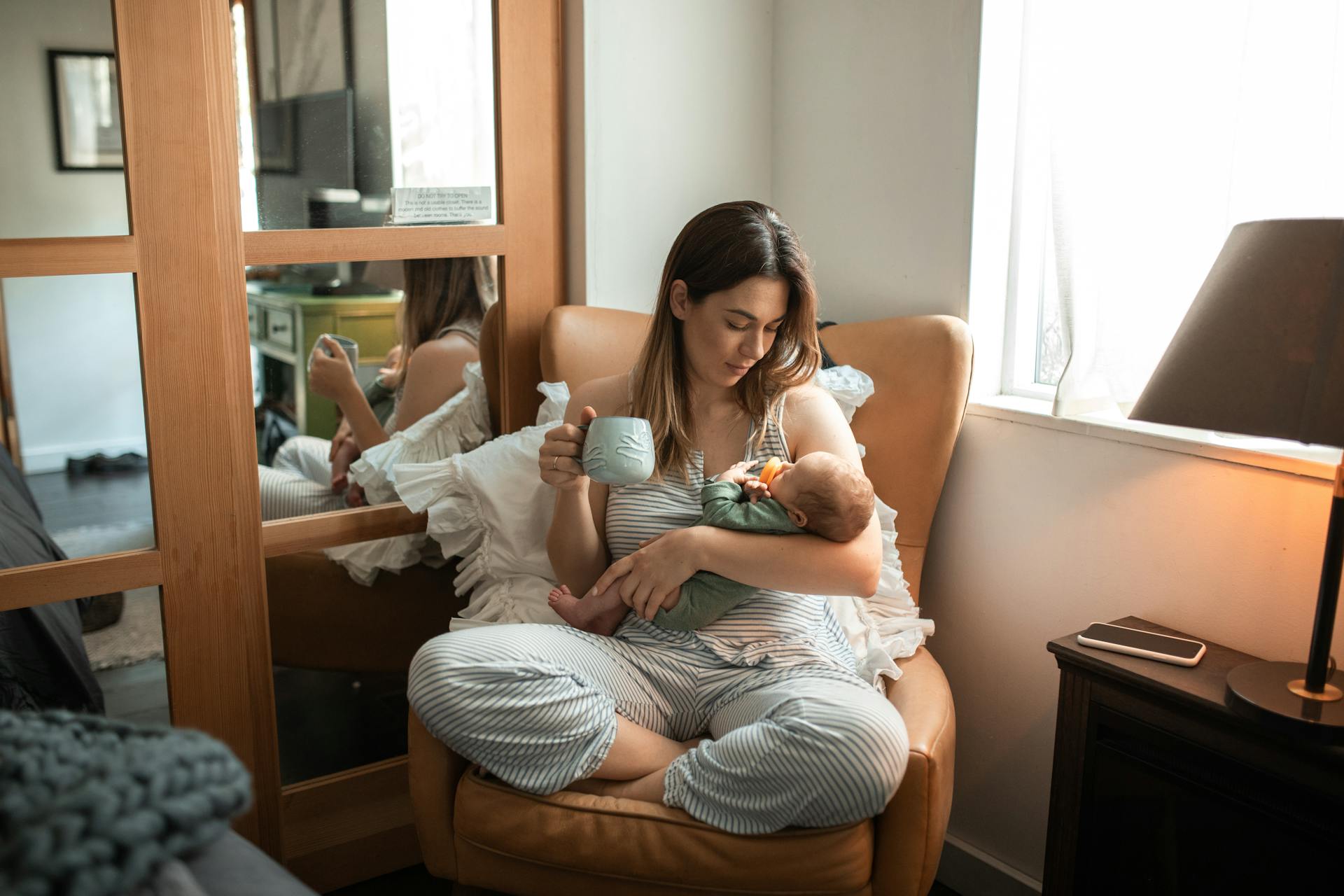 A woman holding a baby | Source: Pexels