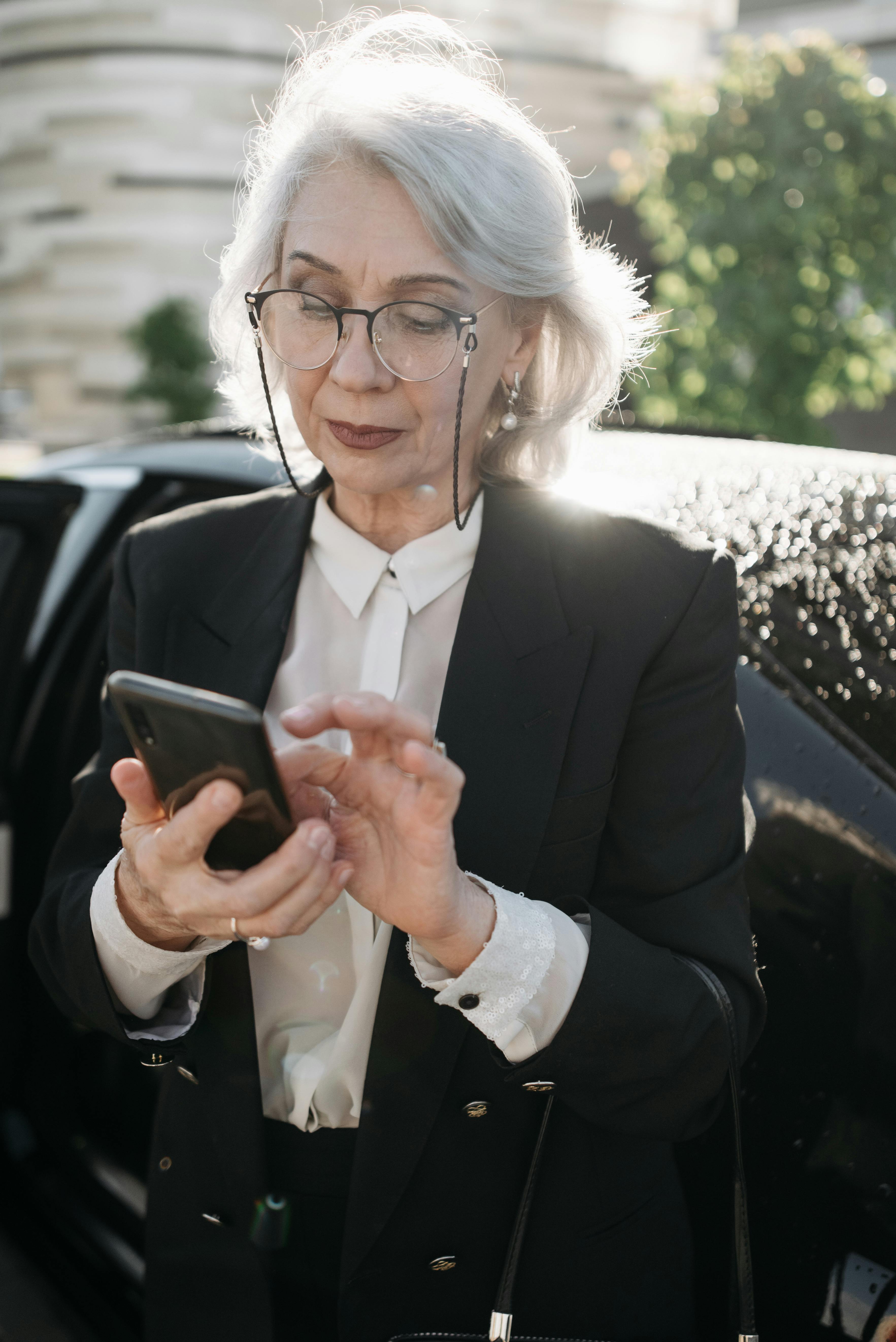 A rich woman stepping out of her car | Source: Pexels