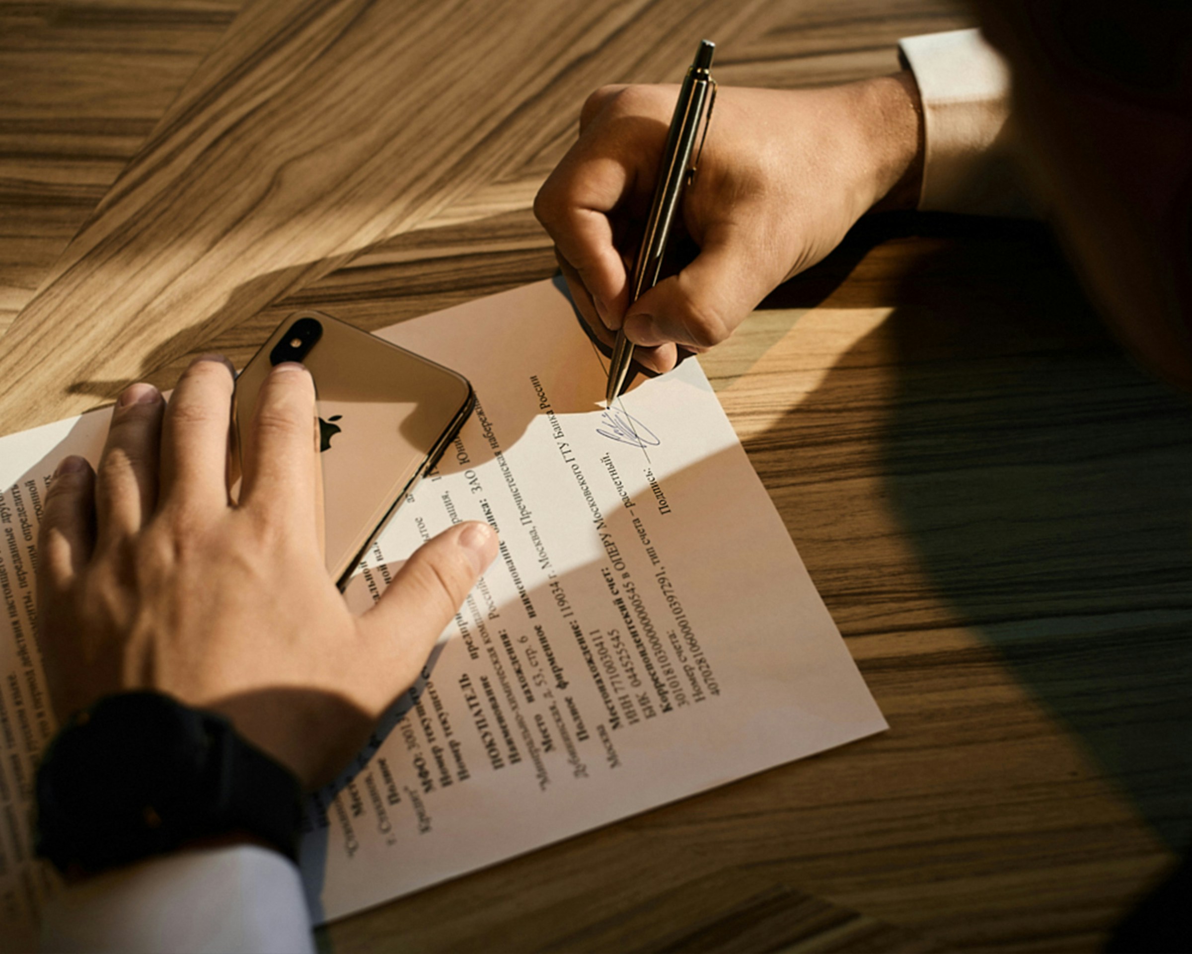 A man signing divorce papers | Source: Unsplash