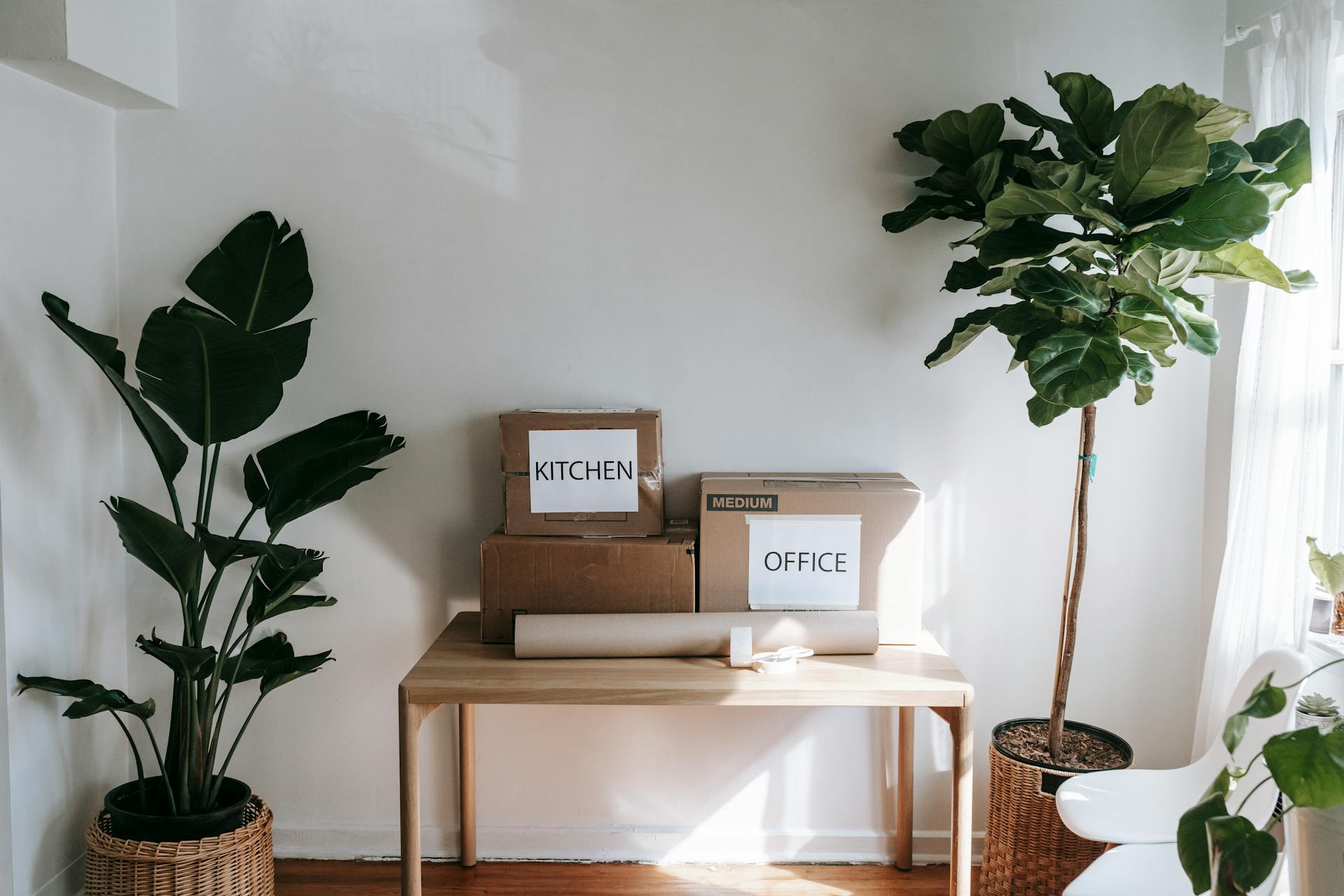 Packing boxes on a table | Source: Pexels