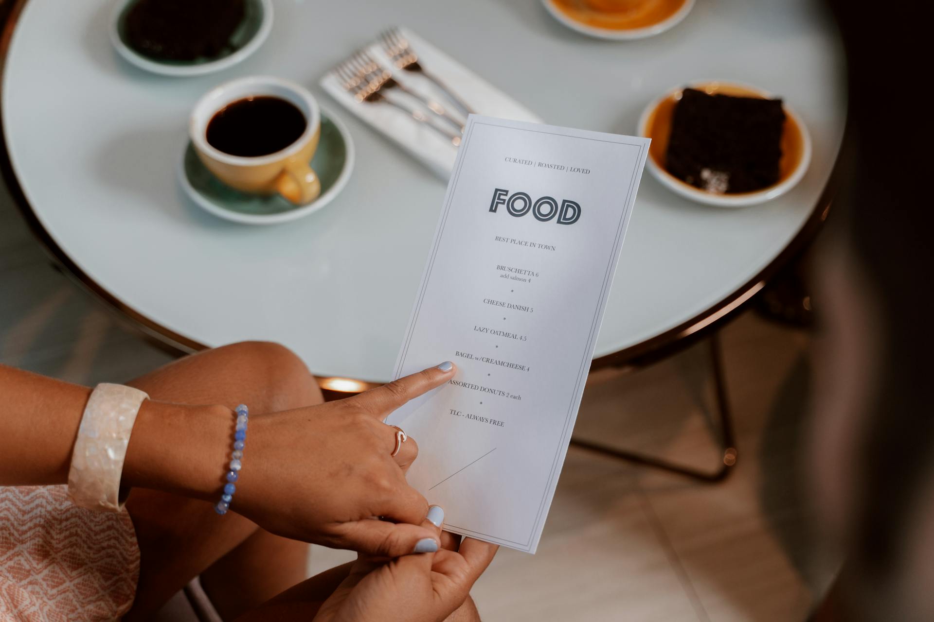 A woman examining a menu | Source: Pexels