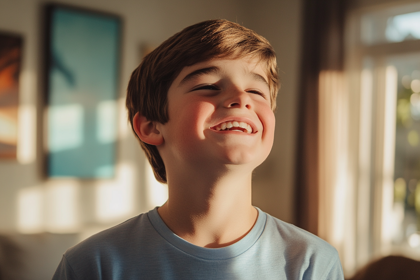 A boy laughing | Source: Midjourney