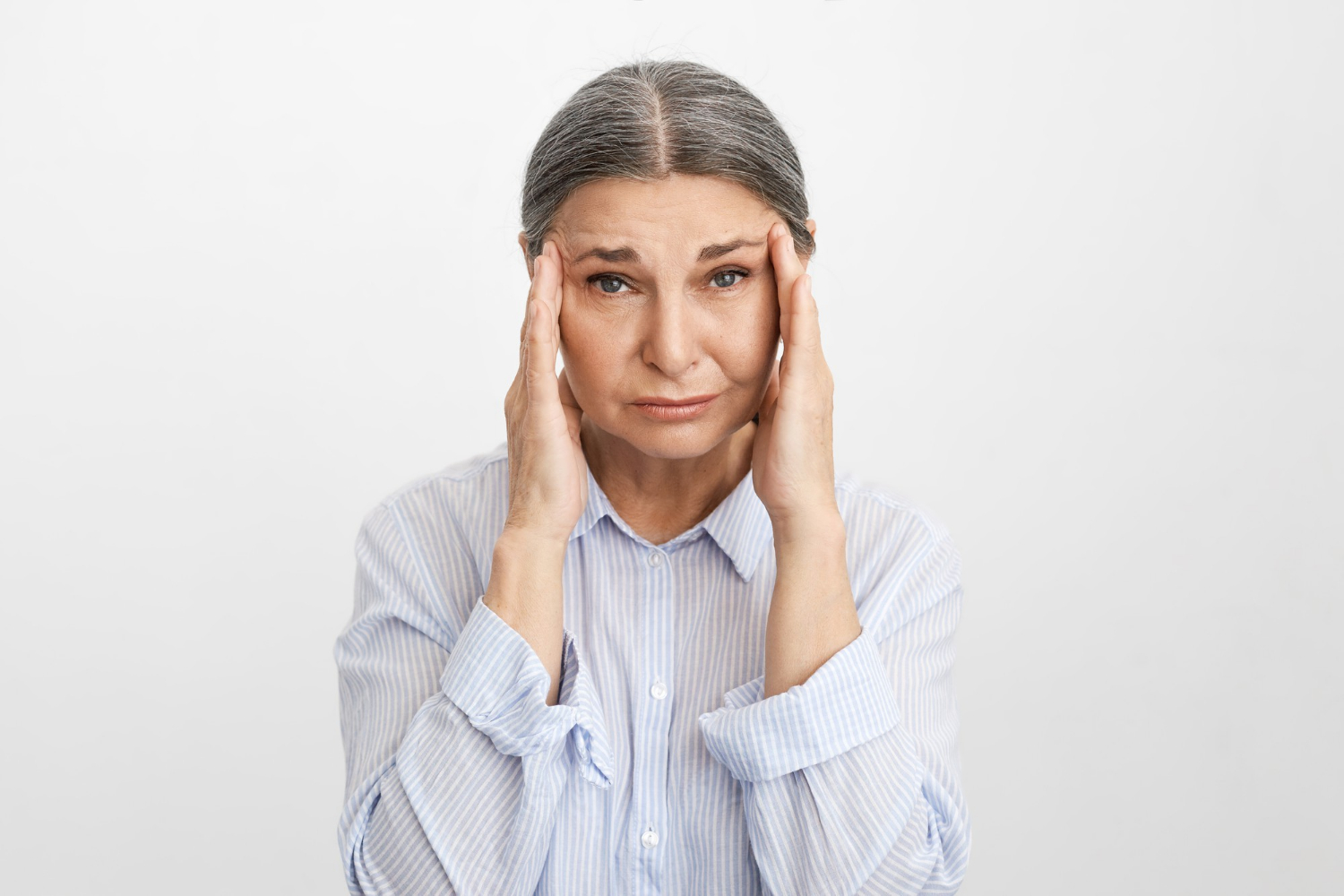 A depressed senior woman | Source: Freepik