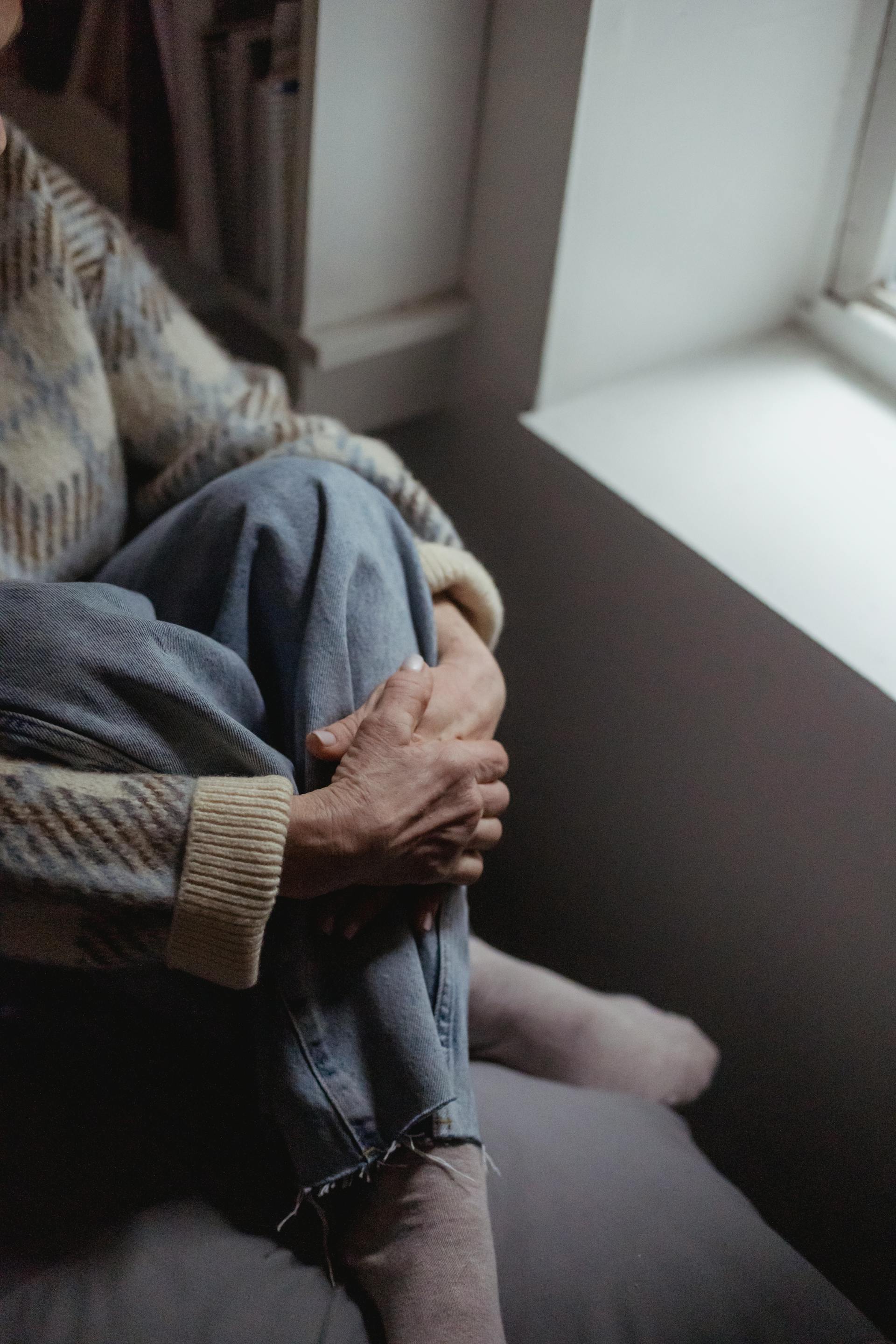 A close-up shot of a woman sitting near the window | Source: Pexels