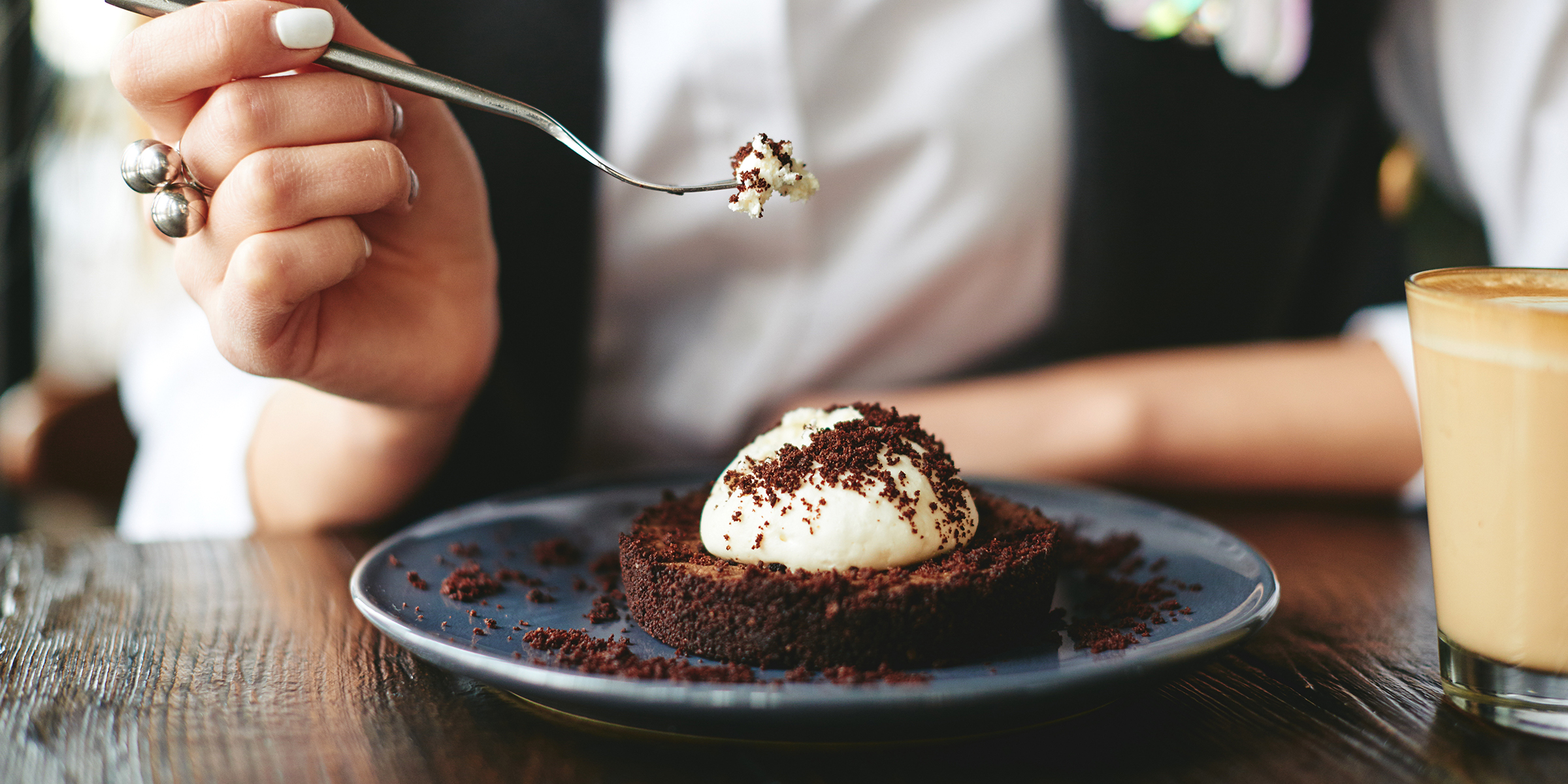 A woman eating dessert | Source: Shutterstock